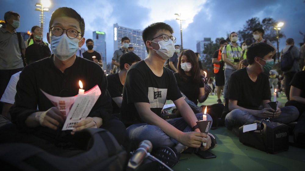 Hong Kong democracy activist Joshua Wong, centre, joins the 2020 vigil for the victims of the 1989 crackdown in Tiananmen Square in Hong Kong’s Victoria Park