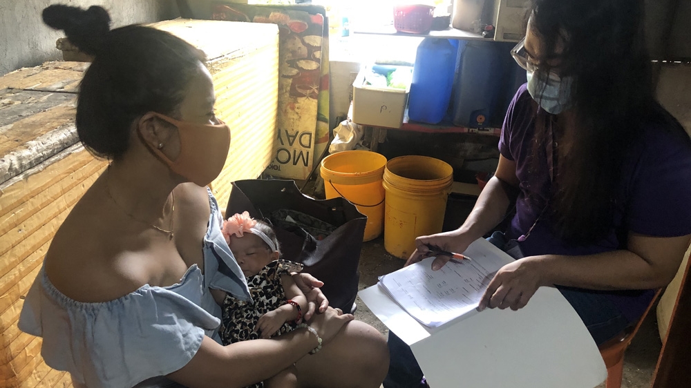 Mak Calsona visits Mildred Jamandron. The 24-year-old says she has been overwhelmed by the situation