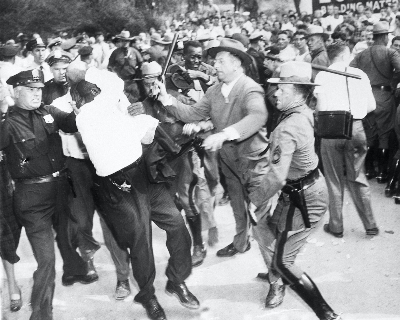 State troopers beat a man leaving Paul Robeson’s concert in Peekskill on September 4; troopers and police, who were supposed to protect concertgoers from anti-Robeson protesters, joined in attacking them instead