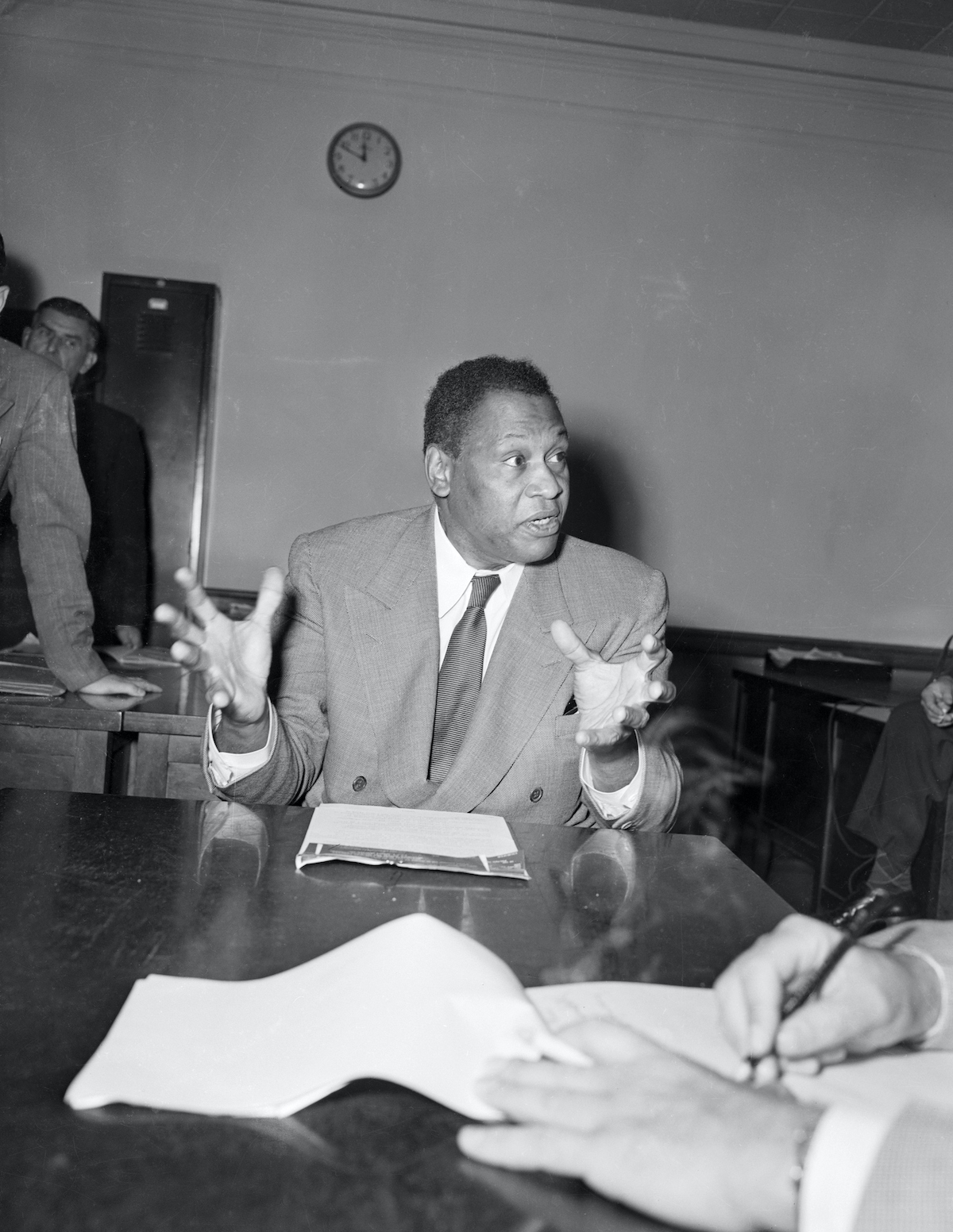 Paul Robeson holds a press conference after he had been on the witness stand for 20 minutes at the trial of the American Communist Party Leaders in New York on September 20th