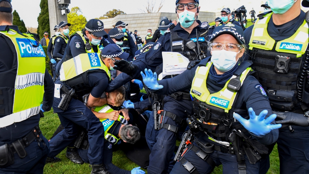 Police tackle protesters in Melbourne