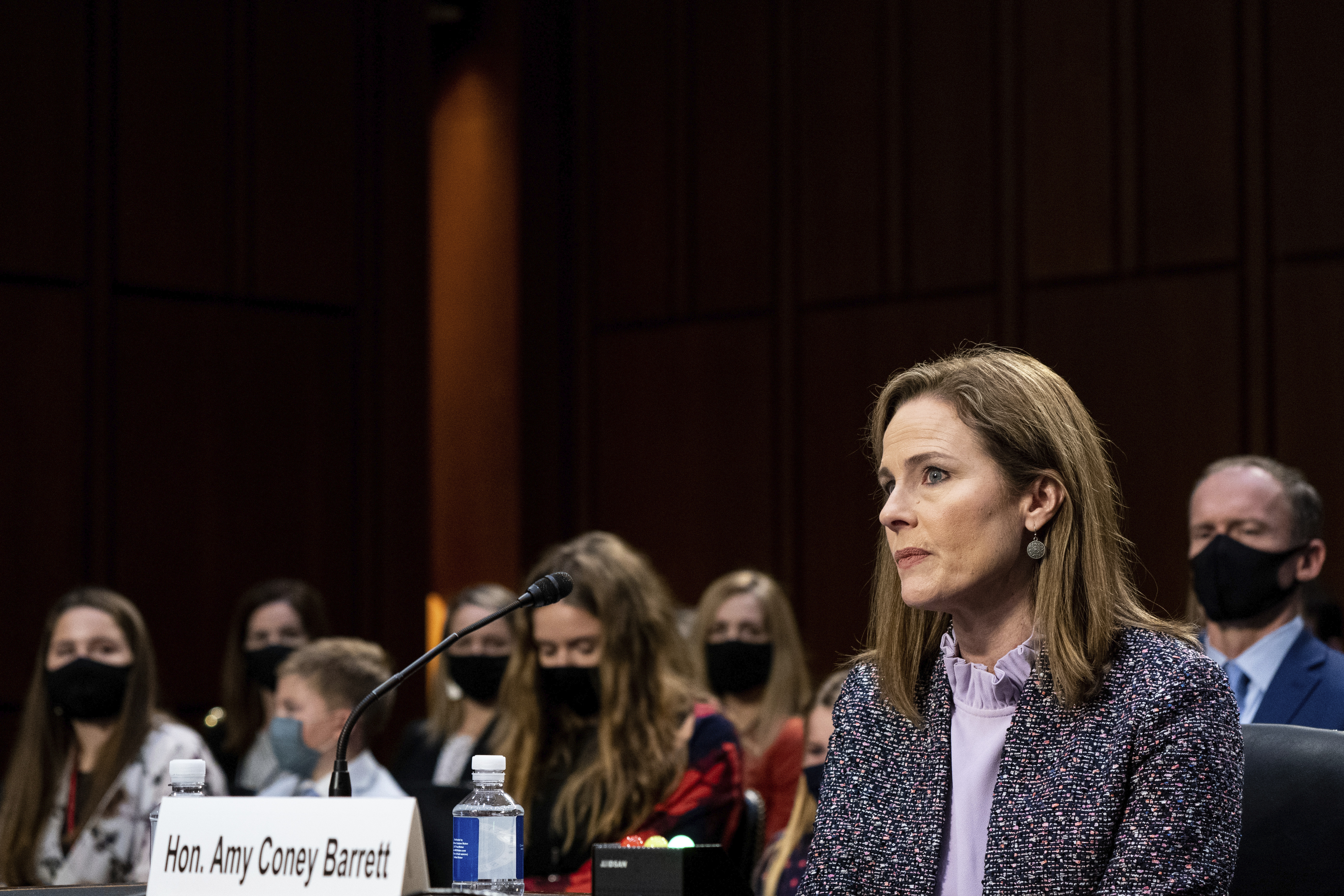 Supreme Court nominee Amy Coney Barrett listens during a confirmation hearing before the Senate Judiciary Committee, Wednesday, October 14, 2020, on Capitol Hill in Washington, DC