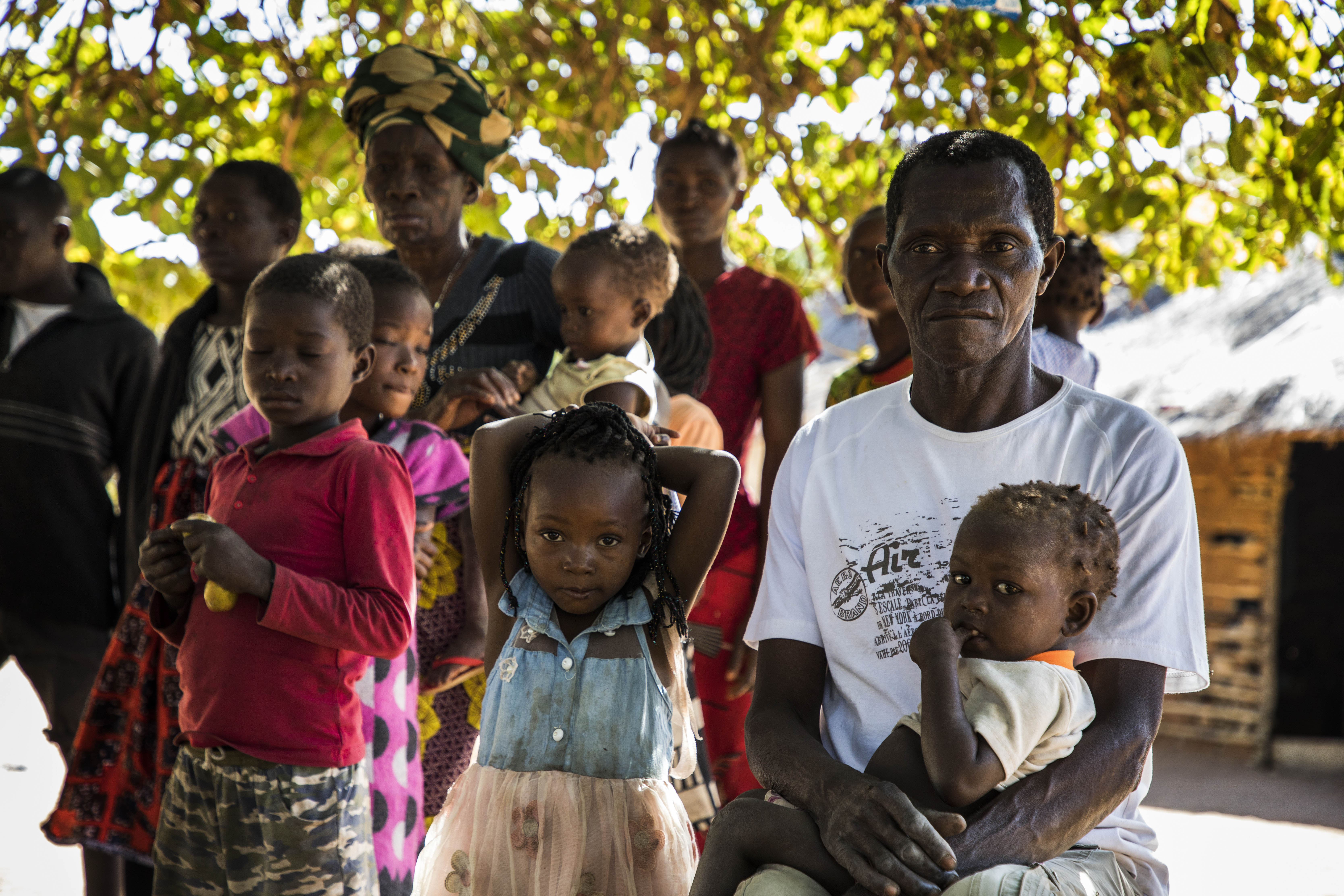 Vicente Tiago, right, heads a family of 30 people who fled attacks in Muidumbe, Cabo Delgado, and took refuge in Pemba City