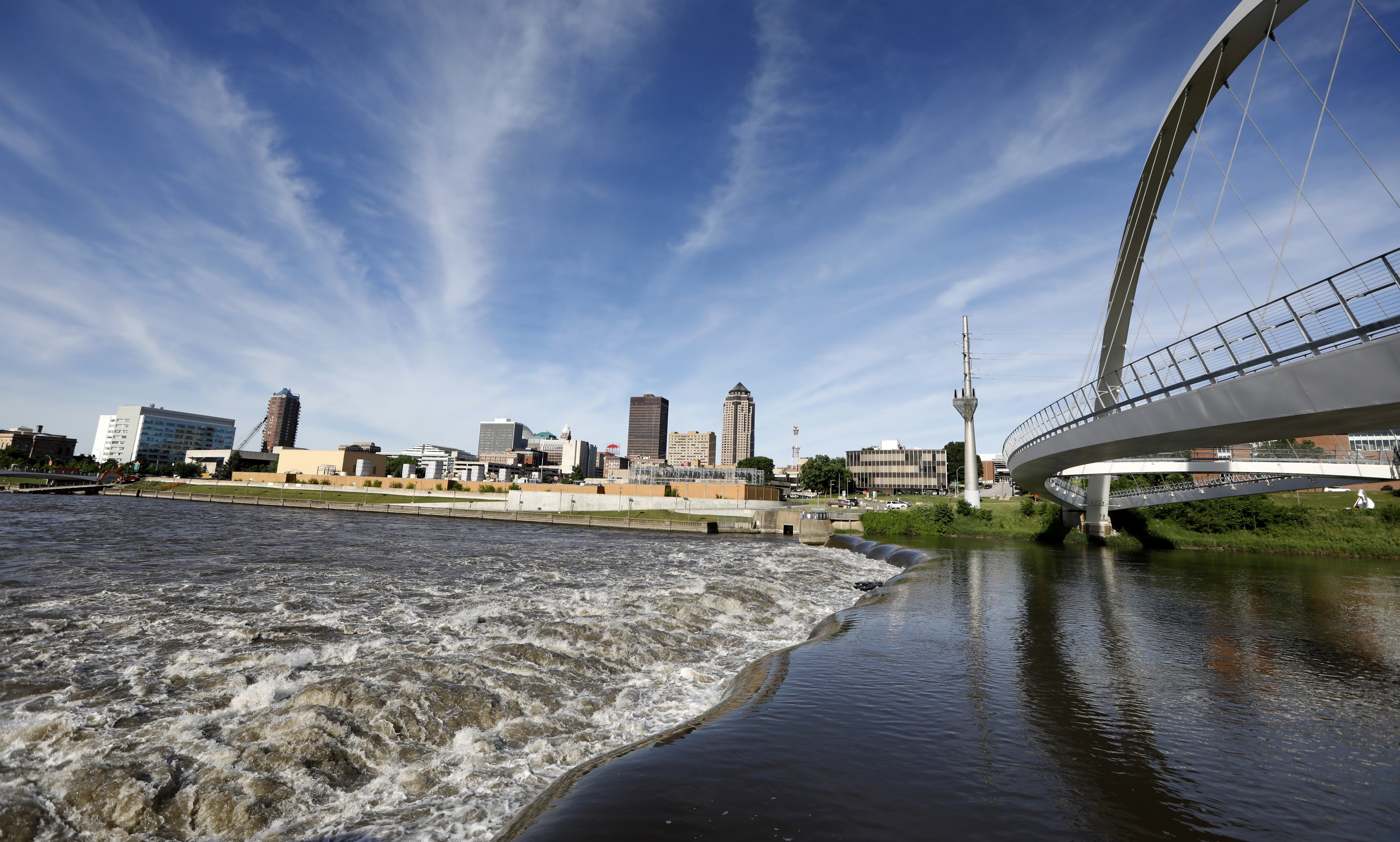 US cities are building whitewater courses and encouraging greater use of urban waterways, but the efforts come as they struggle with pollution in their rivers, like in Des Moines, Iowa