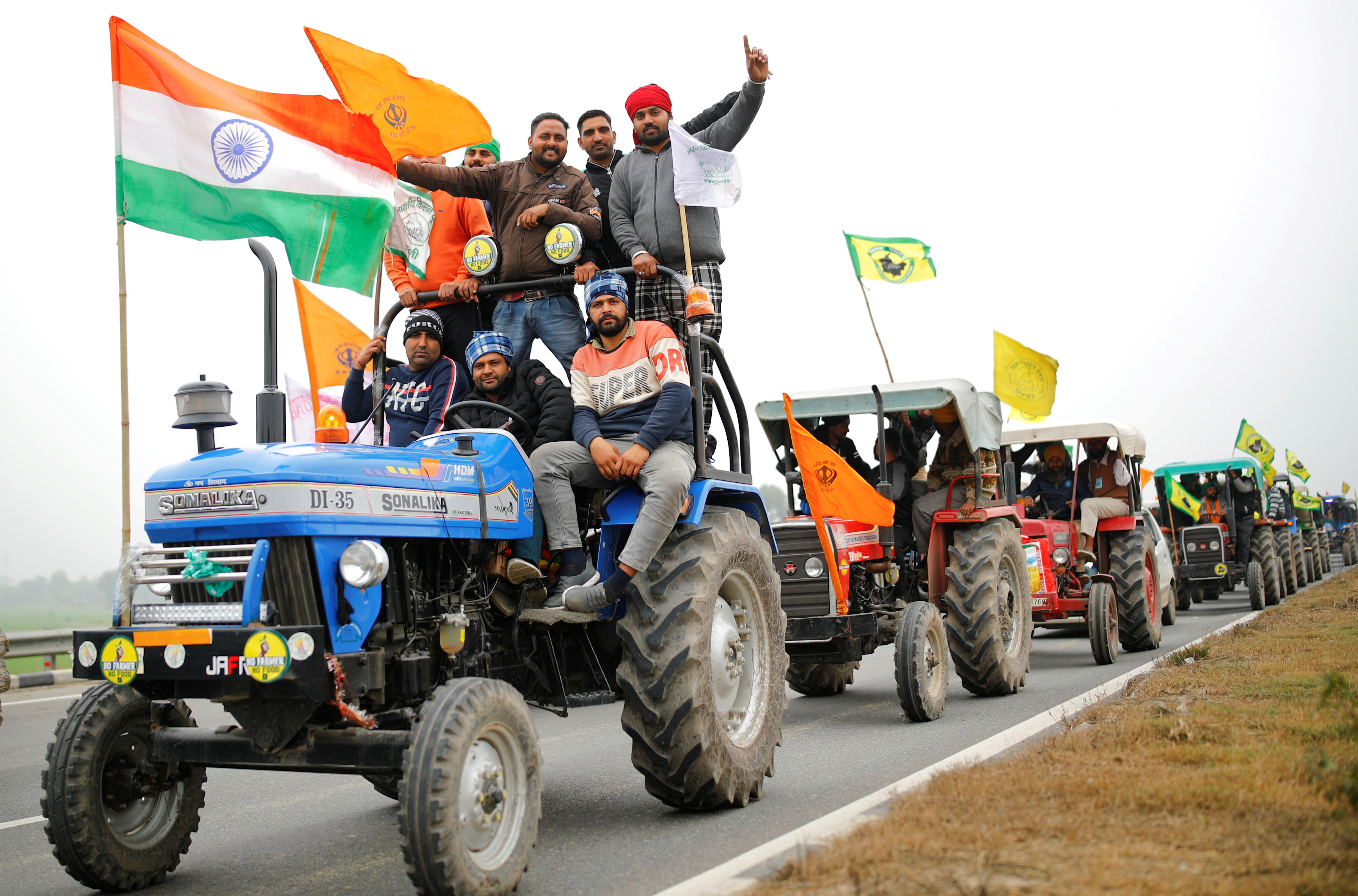 Farmers participate in a tractor rally on January 7, 2020, to protest against the farm laws, on a highway on the outskirts of New Delhi, India