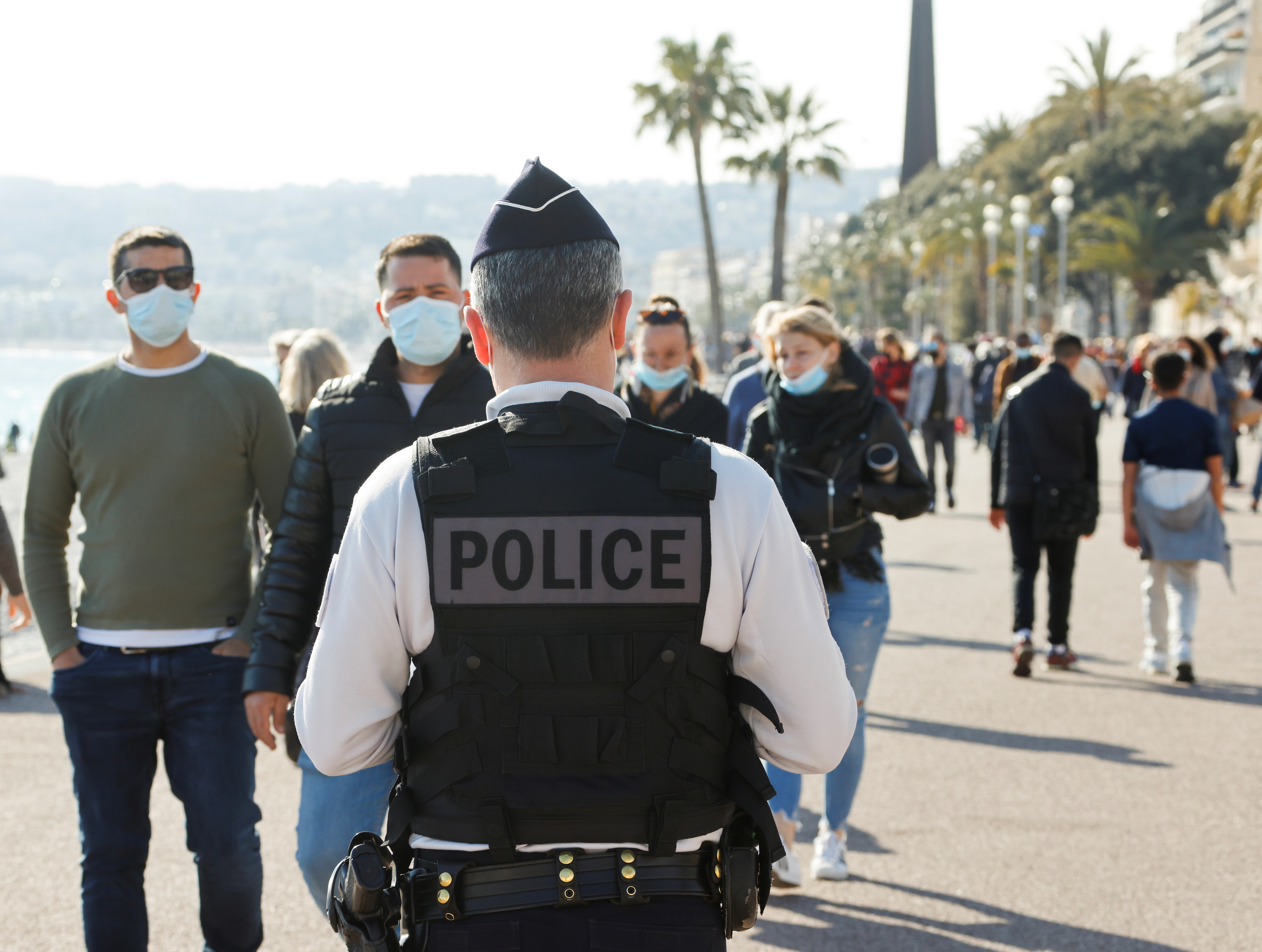 A French police officer patrols on the Promenade des Anglais during the third lockdown imposed to slow the rate of the coronavirus disease (COVID-19) contagion, in Nice