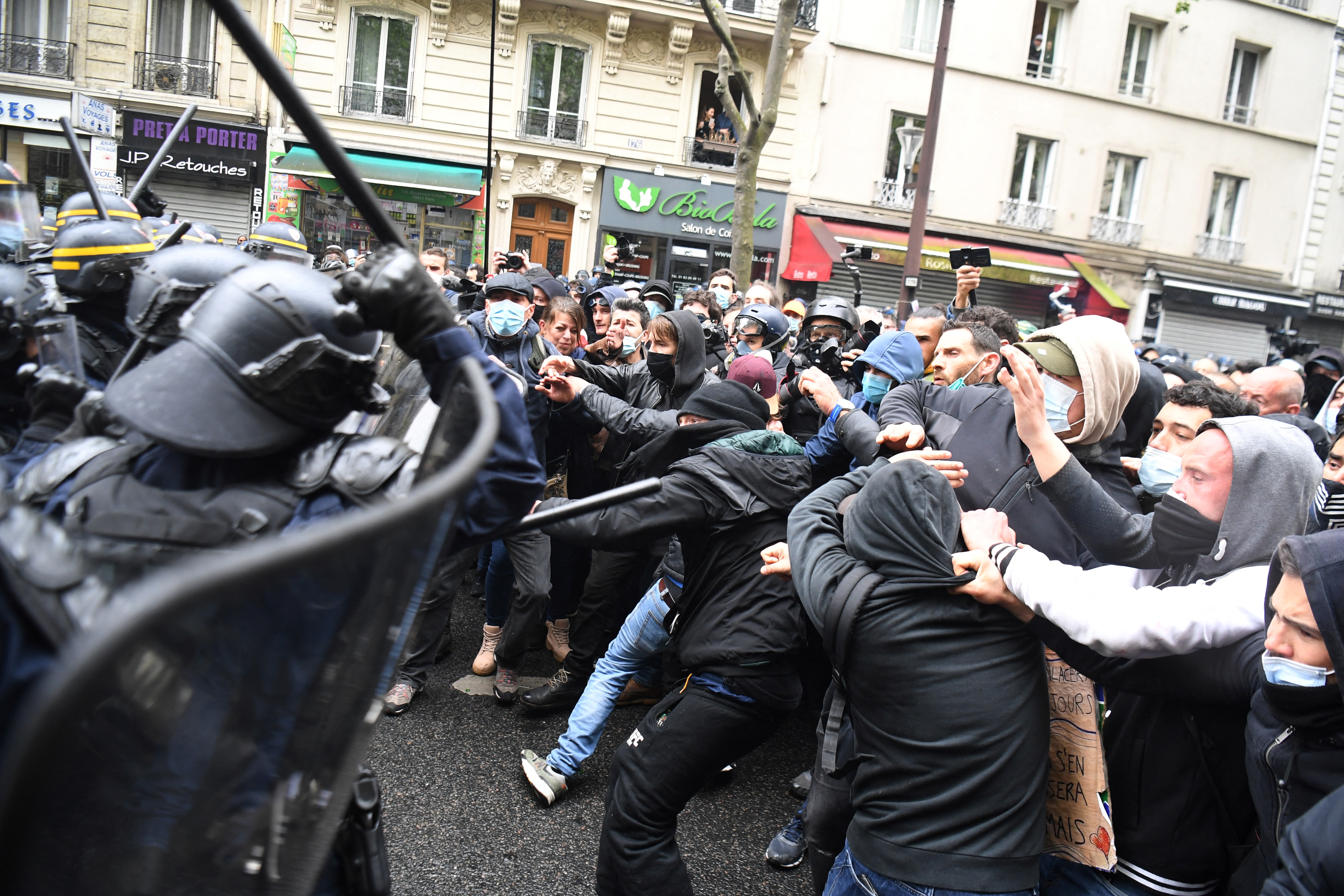 Protesters clash with police during the annual May Day rally in Paris