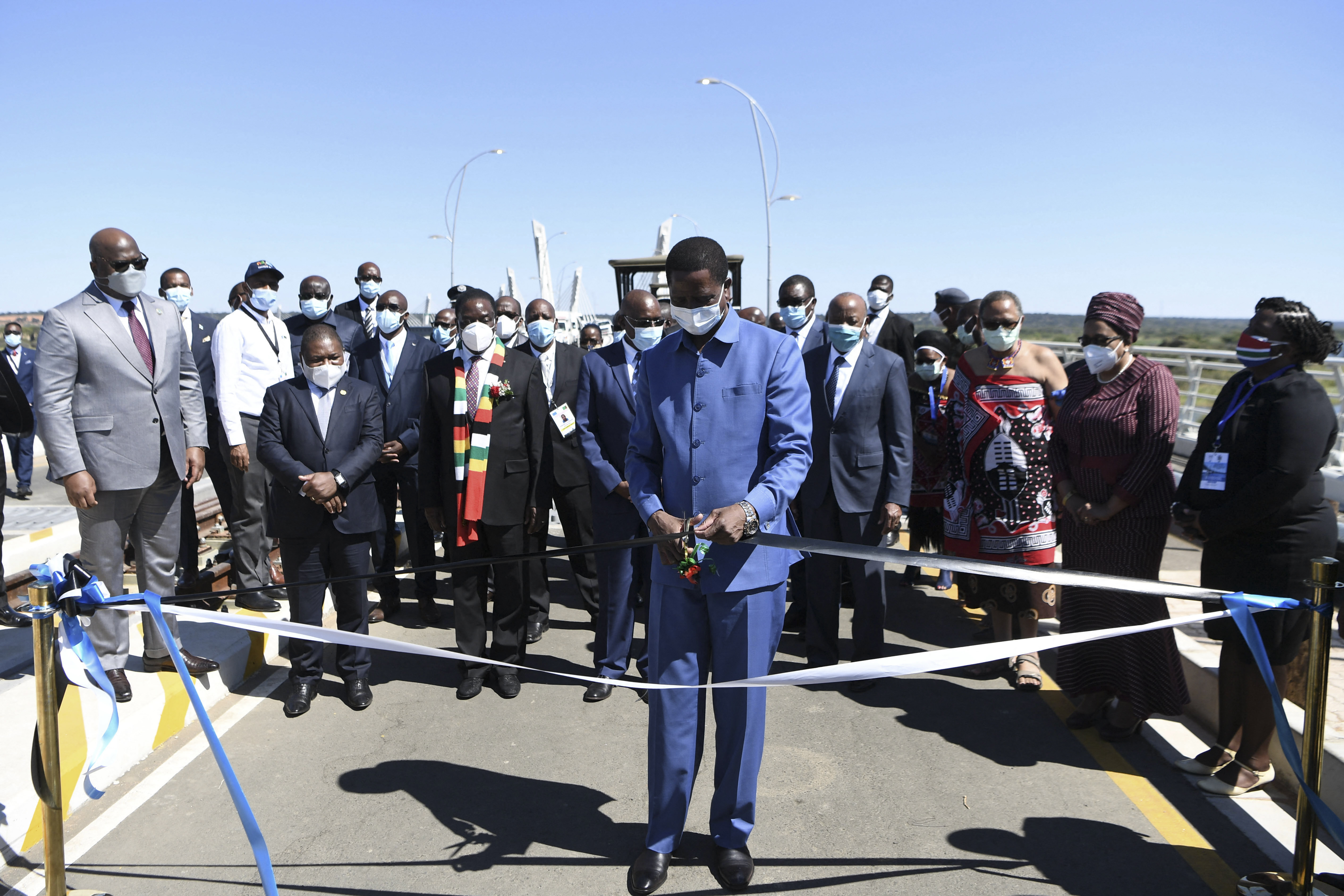 Zambian President Edgar Lungu (cuts a ribbon to mark the official opening of the bridge