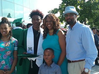 Terrence James (right) died from COVID-19 on February 19, 2021, leaving behind his wife, Ebony, and their three children [Courtesy: Ebony James]