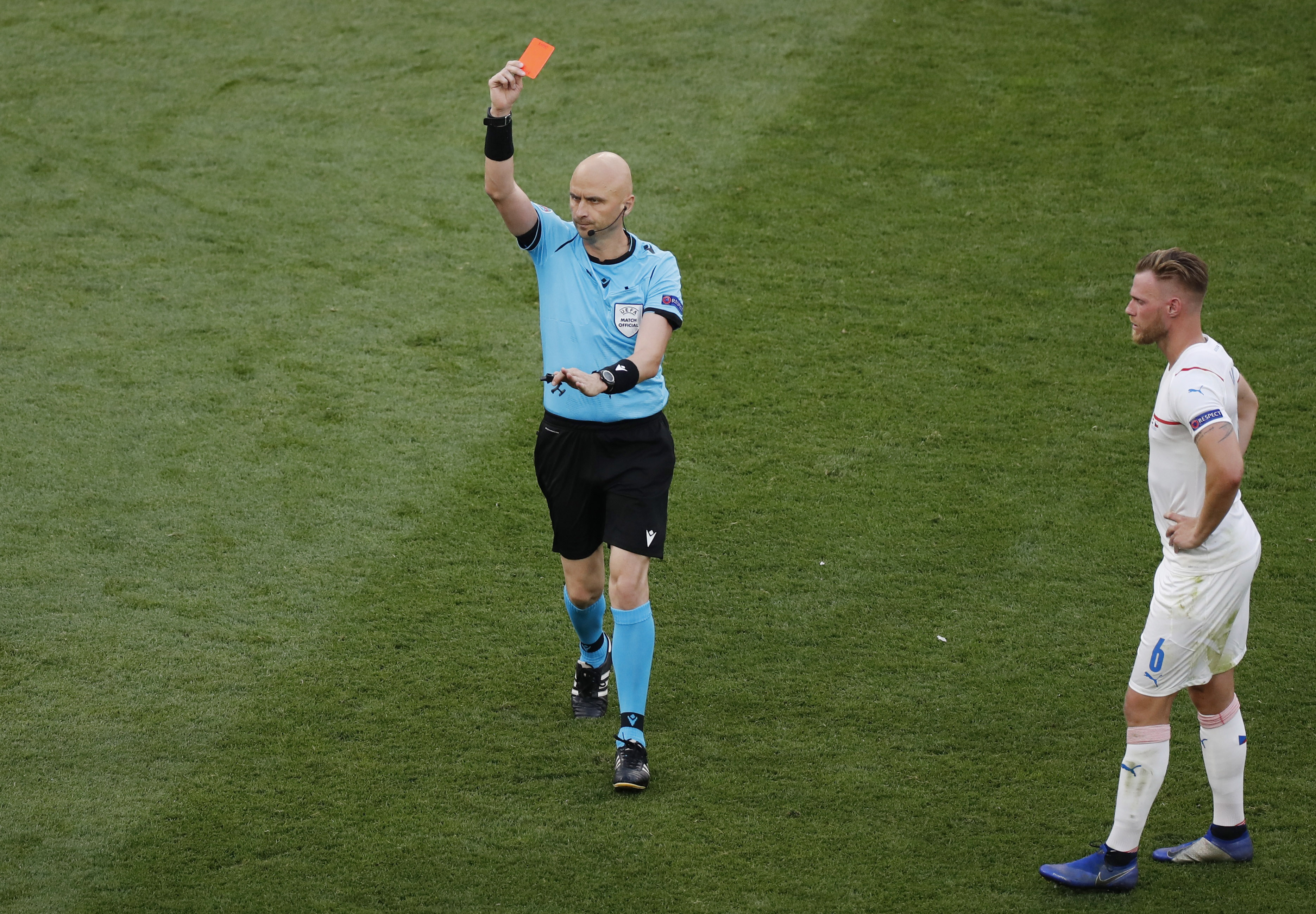 The Netherlands’ Matthijs de Ligt is shown a red card by referee Sergei Karasev