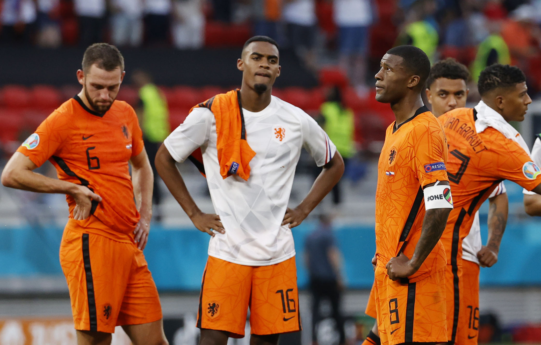 The Netherlands’ Stefan de Vrij, Ryan Gravenberch and Georginio Wijnaldum look dejected after the match