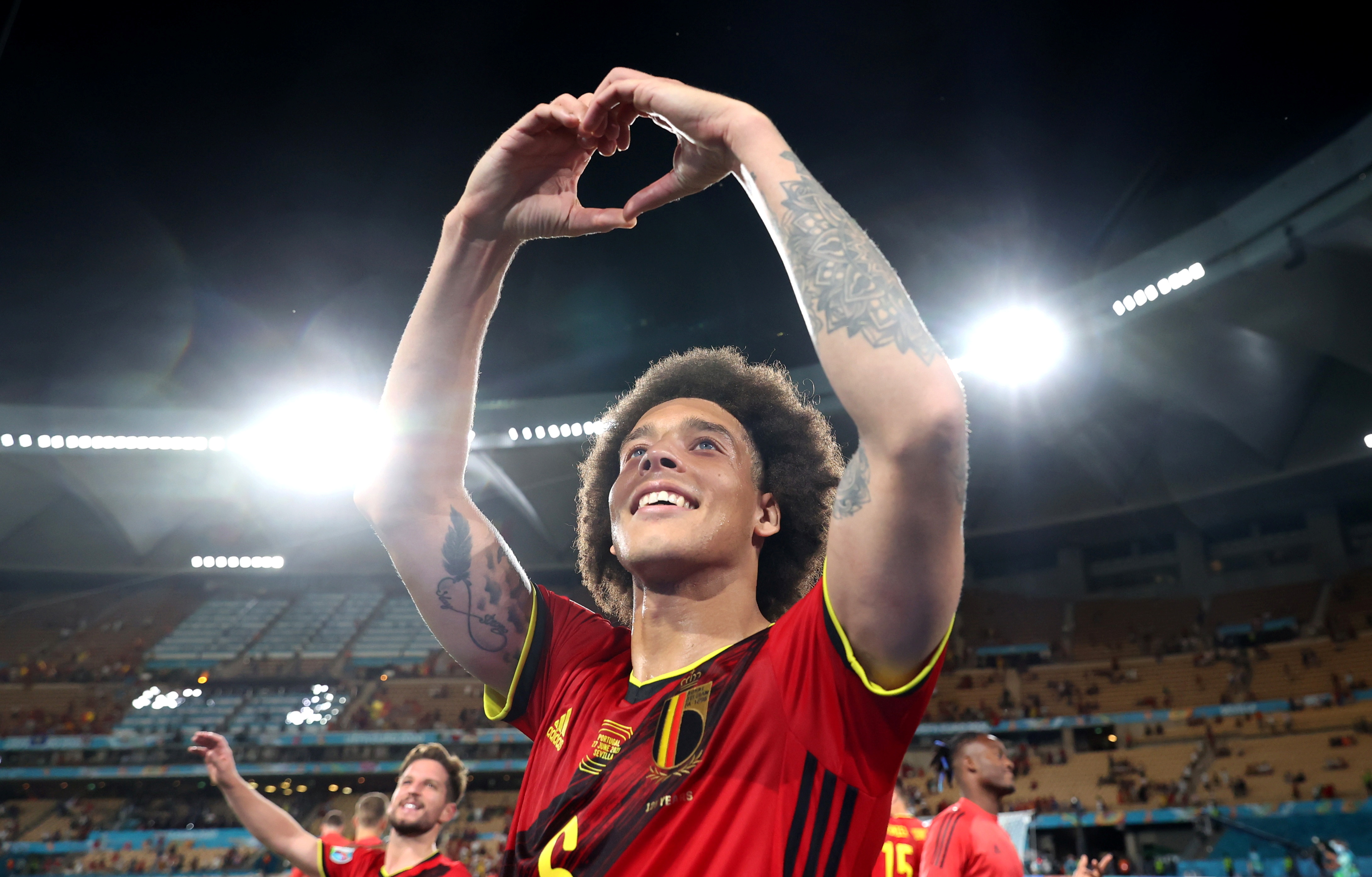 Belgium’s Axel Witsel celebrates after the match