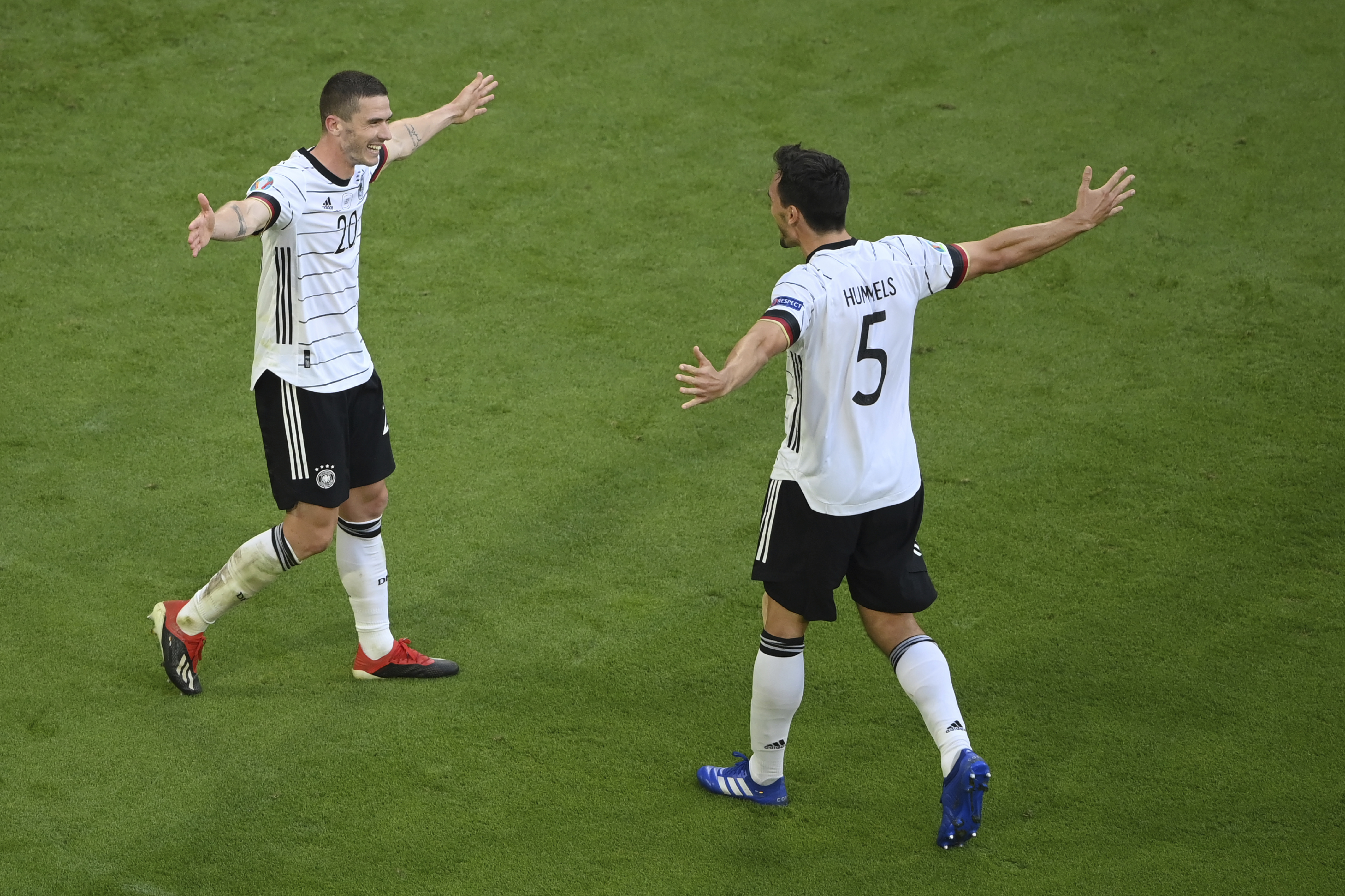 Germany’s Robin Gosens, left, celebrates Germany’s Mats Hummels after scoring his side’s fourth goal against Portugal