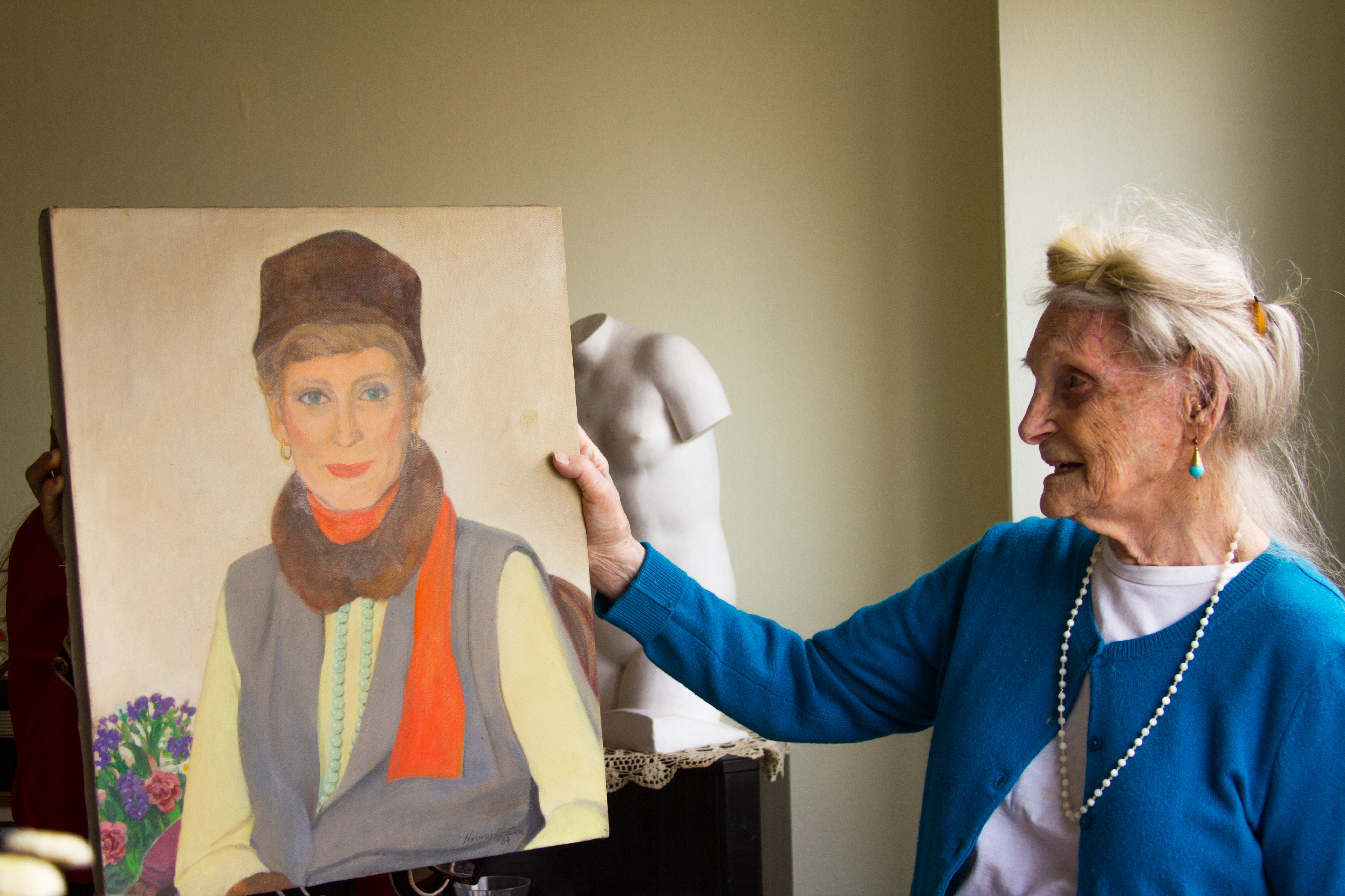 Robina with a portrait that her husband, Norwood, painted of her