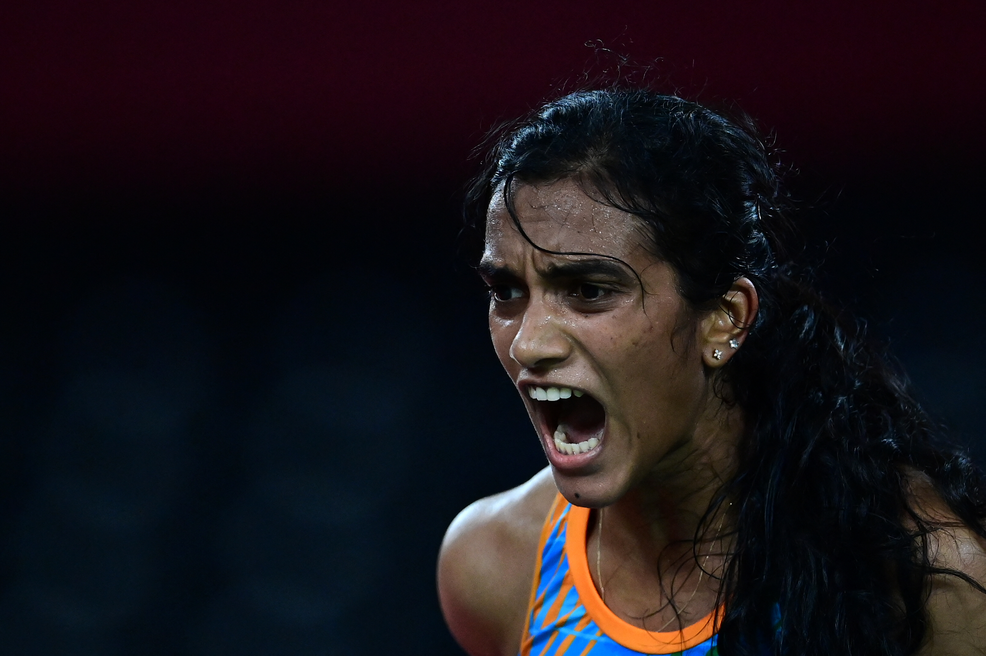 Sindhu reacts after a point against China’s He Bingjiao in the women’s singles badminton bronze medal match in Tokyo
