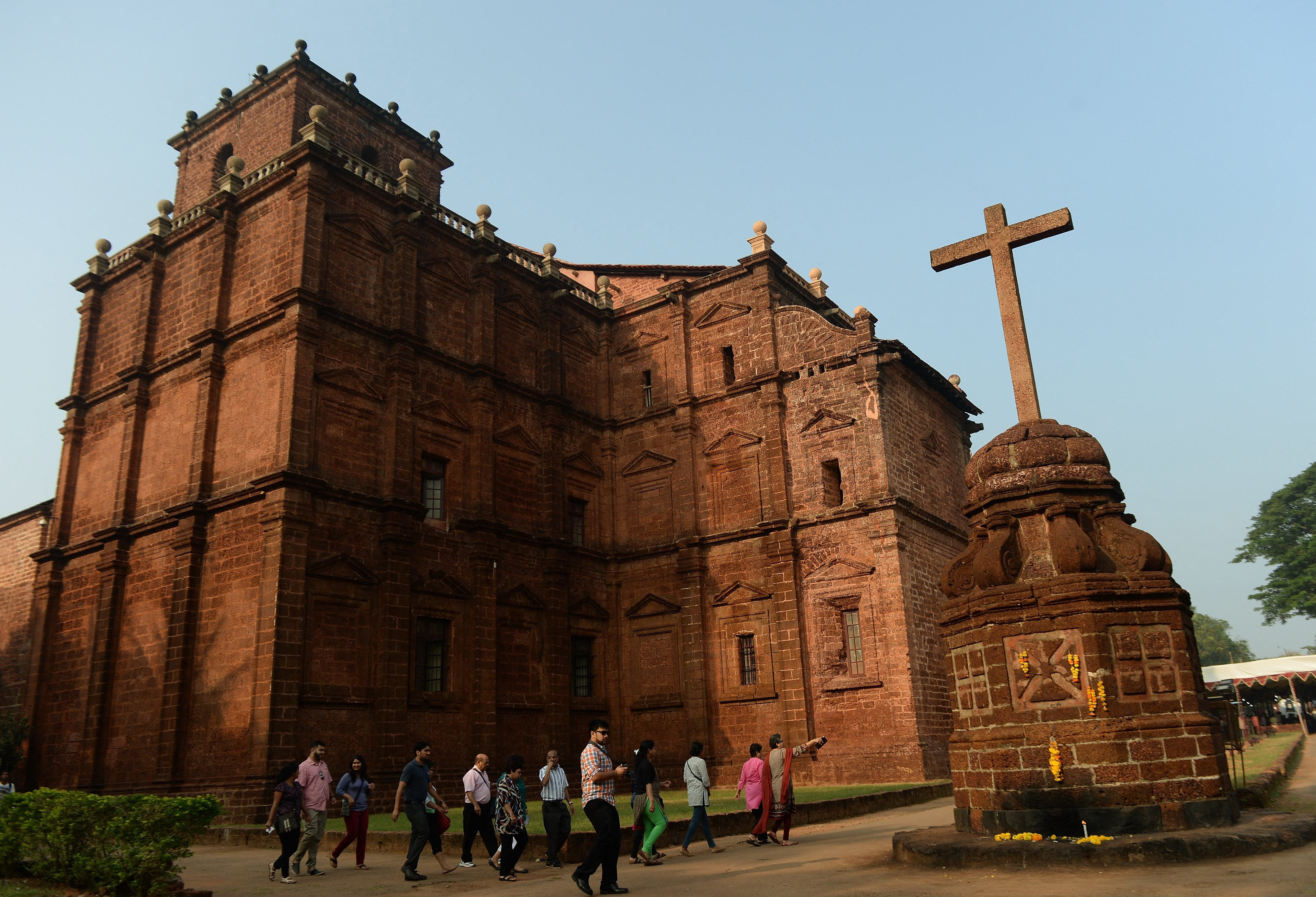 Tourists at the Basilica of Bom Jesus before the start of a procession carrying the remains of St Francis Xavier in Goa