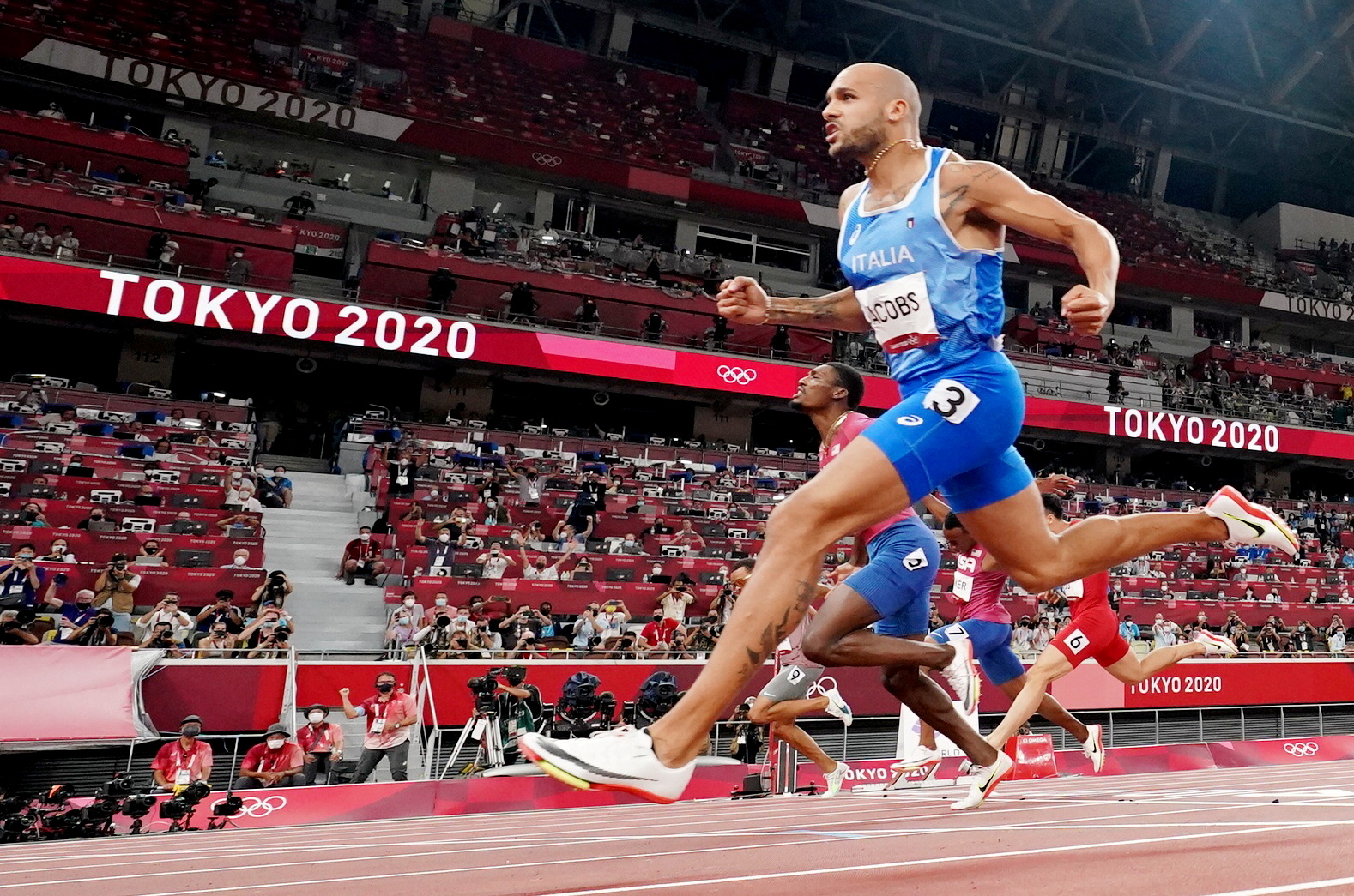 Lamont Marcell Jacobs of Italy crosses the finish line and wins gold in Tokyo