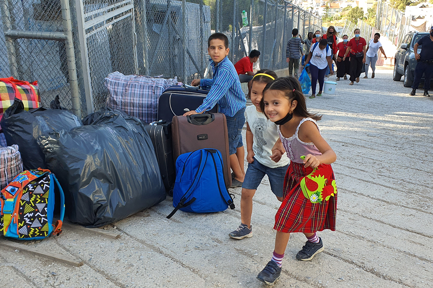 Refugee children arrive leave the former, overcrowded camp in Samos, which is set to be bulldozed