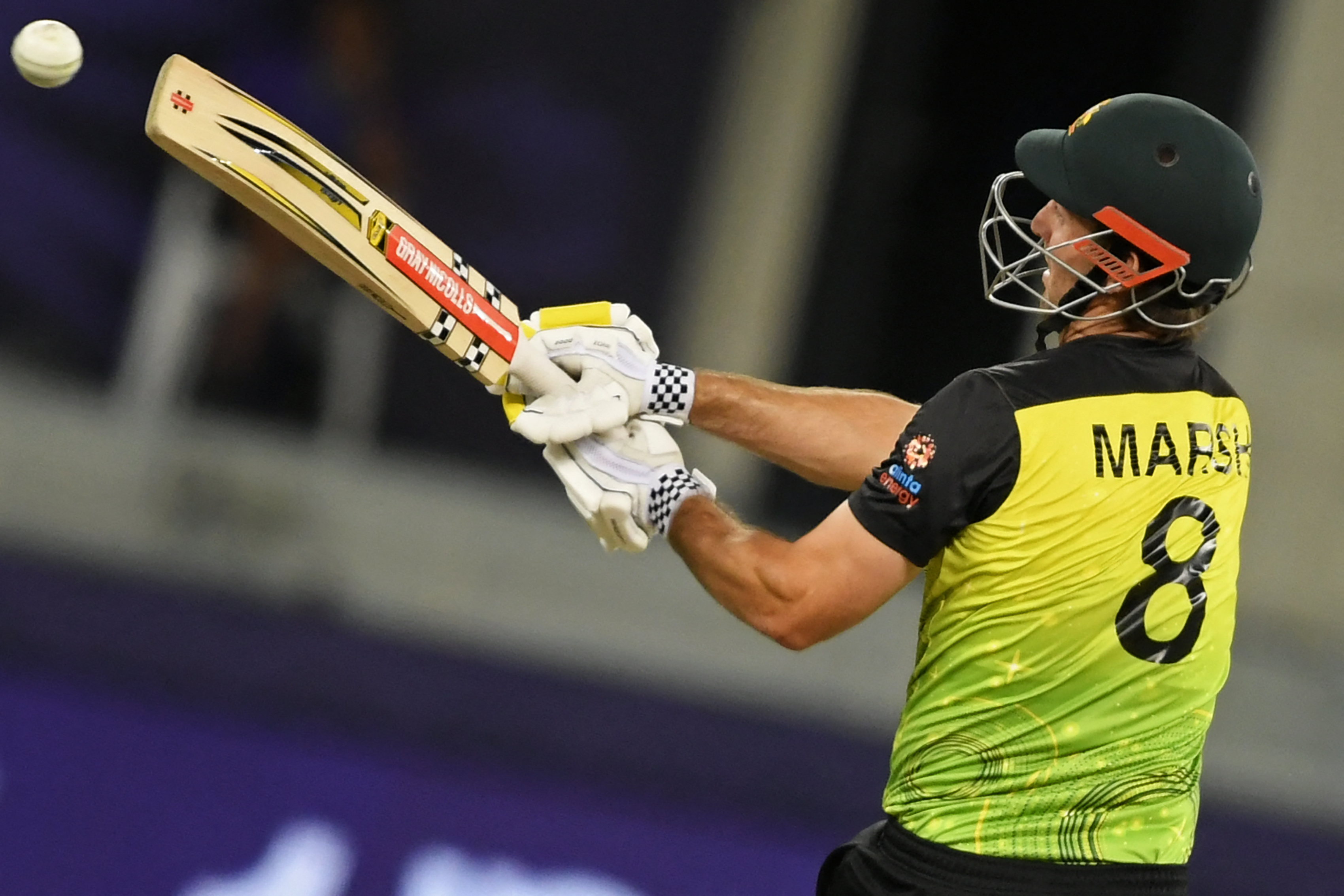 Australia’s Mitchell Marsh plays a shot during the ICC mens Twenty20 World Cup semi-final match between Australia and Pakistan at the Dubai International Cricket Stadium in Dubai on November 11, 2021.