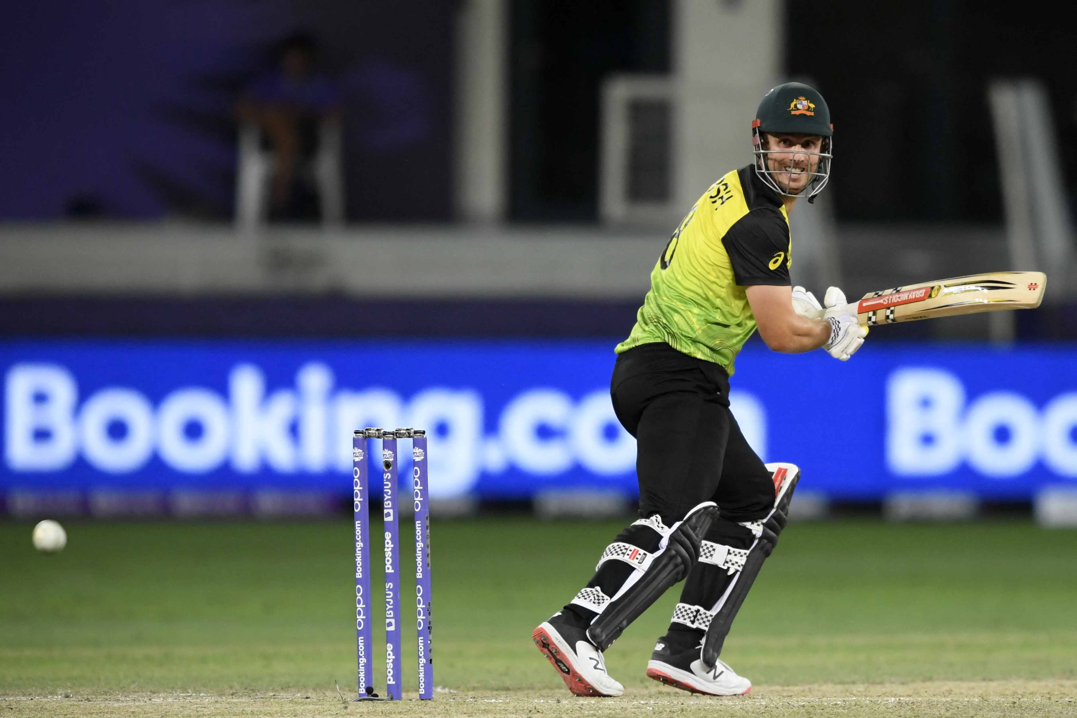 Australia’s Mitchell Marsh watches the ball after playing a shot during the ICC men’s Twenty20 World Cup semi-final match between Australia and Pakistan at the Dubai International Cricket Stadium in Dubai on November 11, 2021