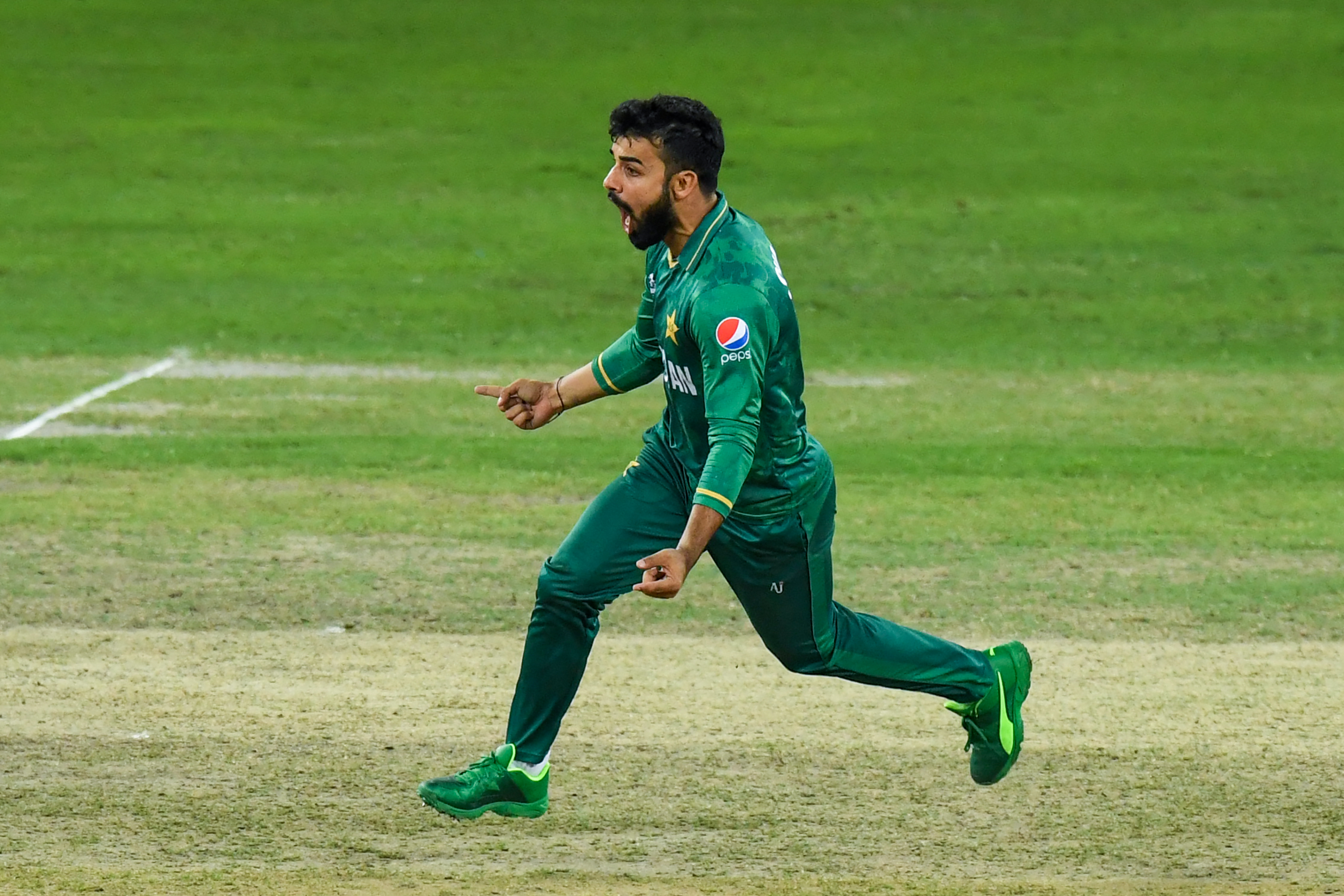 Pakistan’s Shadab Khan celebrates after dismissing Australia’s David Warner (not pictured) during the ICC men’s Twenty20 World Cup semi-final match between Australia and Pakistan at the Dubai International Cricket Stadium in Dubai on November 11, 2021