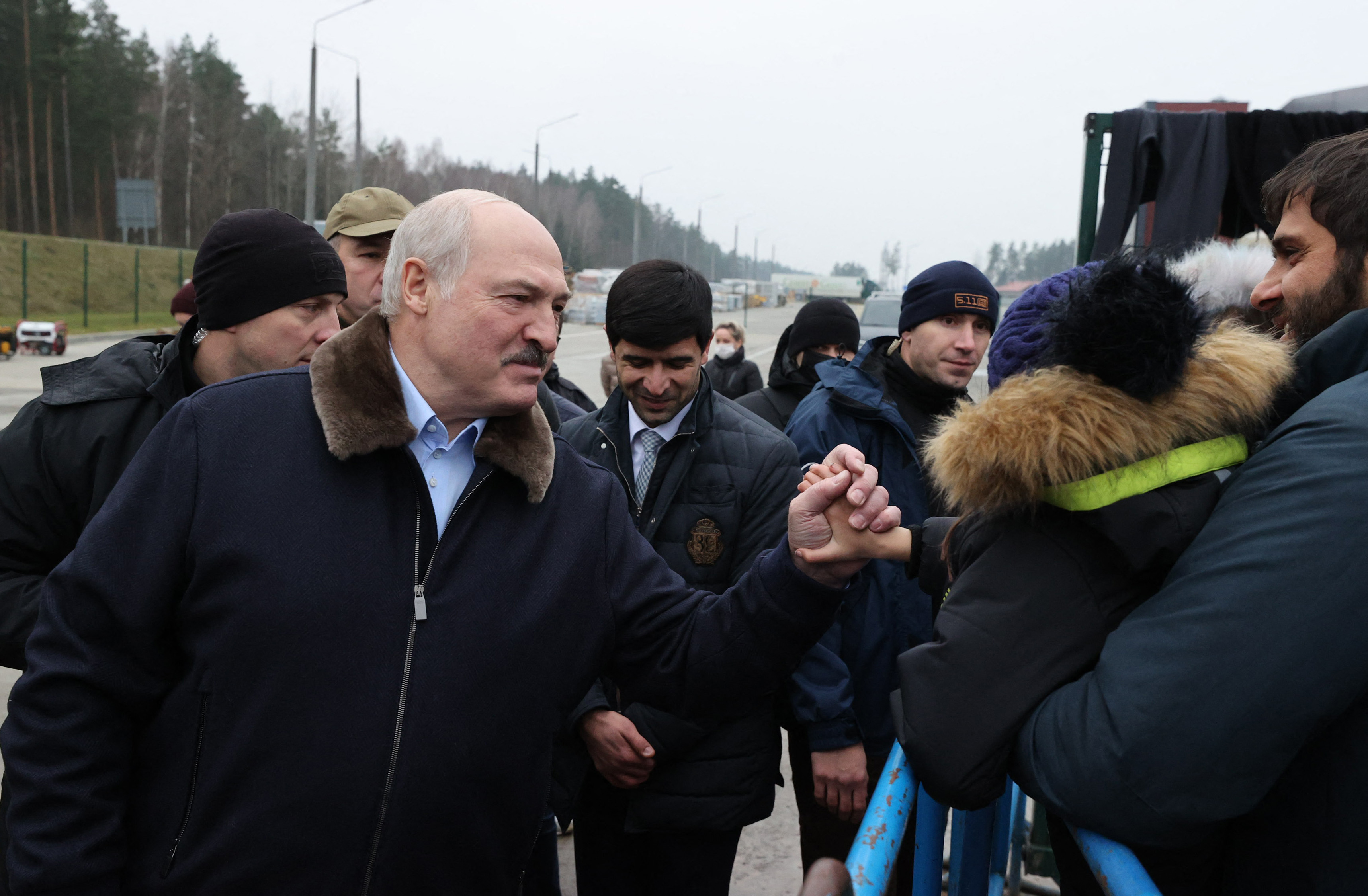 Belarus’s President Alexander Lukashenko visits a centre for asylum seekers and refugees near the Bruzgi border point on the Belarus-Poland border