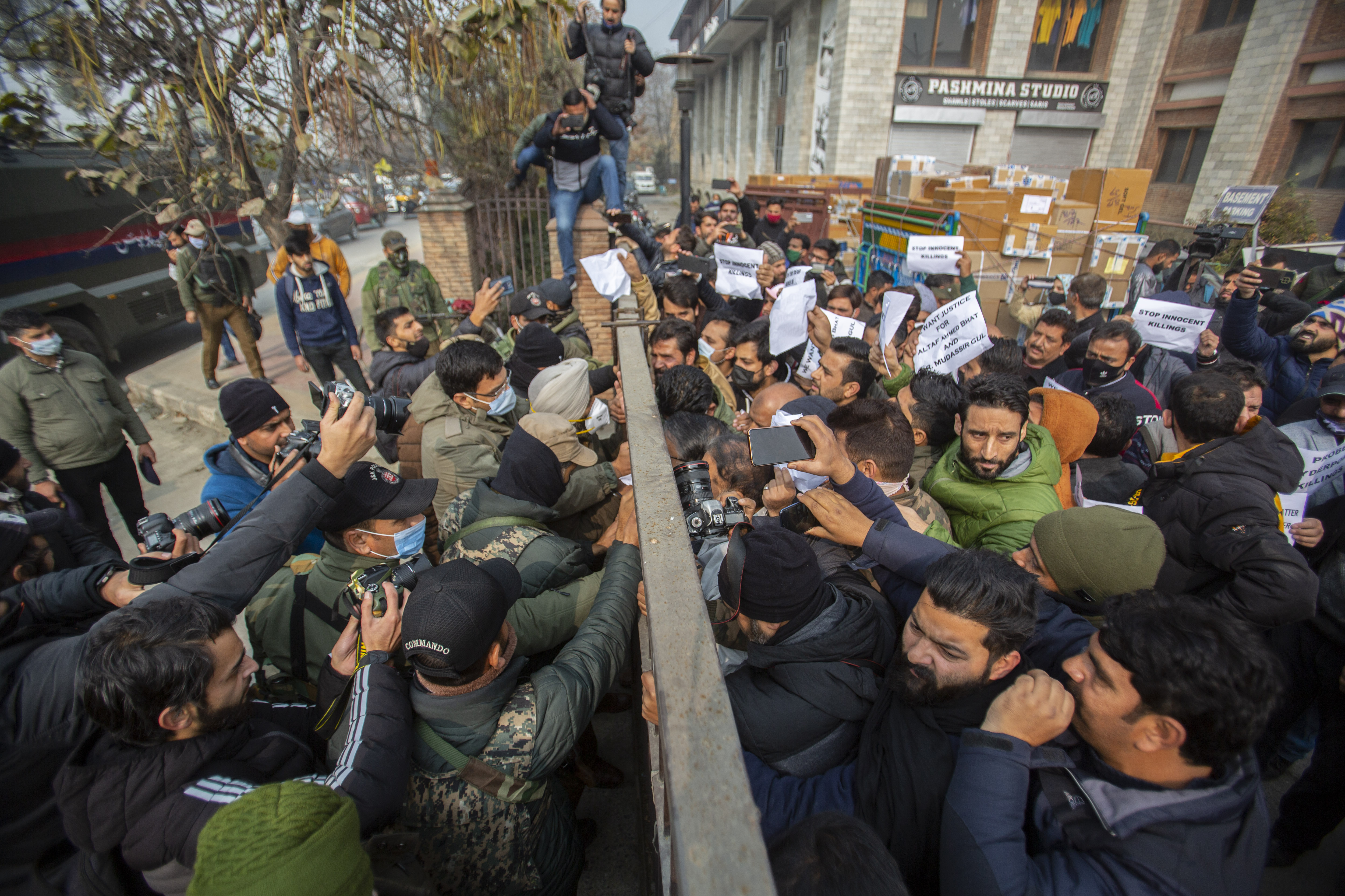 People shout slogans during a protest demanding the return of dead bodies of civilians for proper burial, in Srinagar
