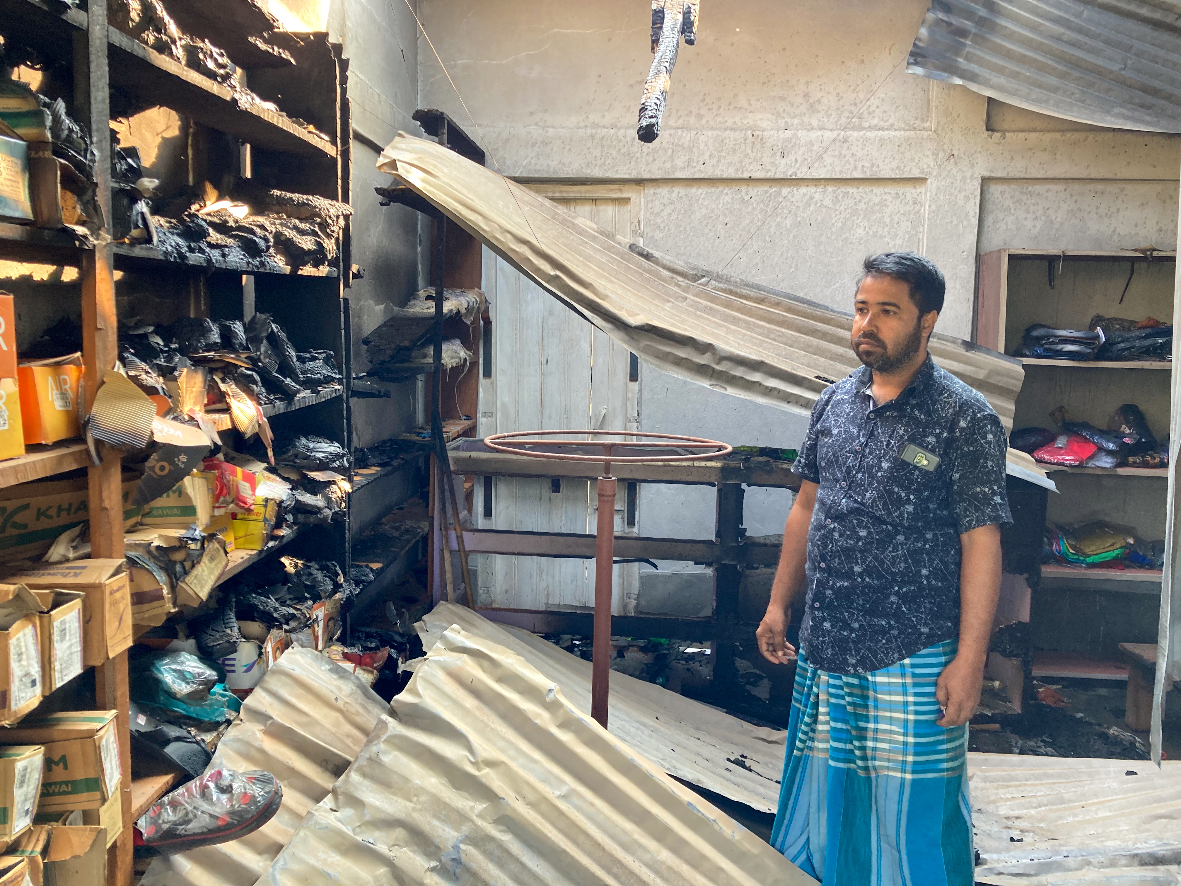 Sanohar Ali at his shop in Rowa market which was attacked during the October 26 violence