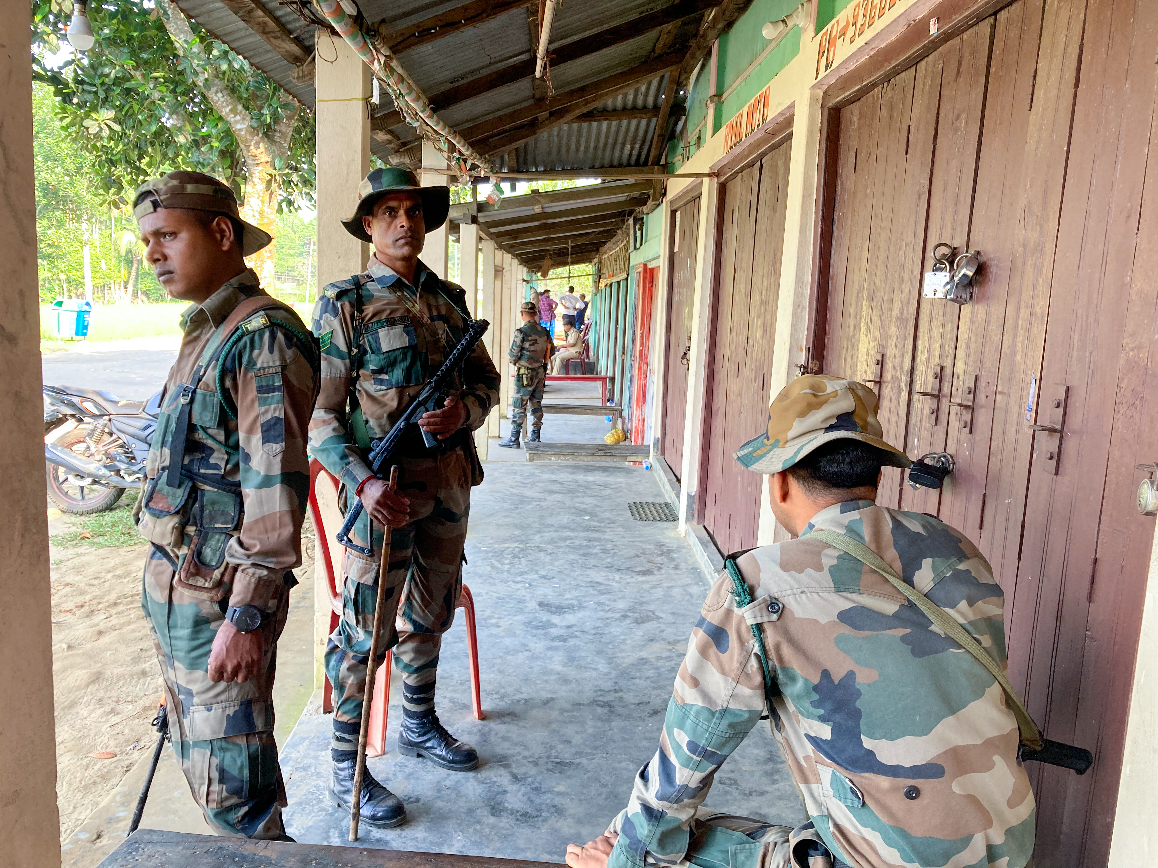 Security personnel at the Rowa market which witnessed arson on October 26