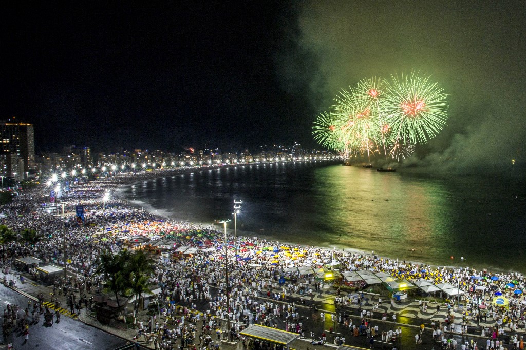 Fireworks go off on Copacabana beach to mark the New Year in Rio de Janeiro, Brazil early on Saturday