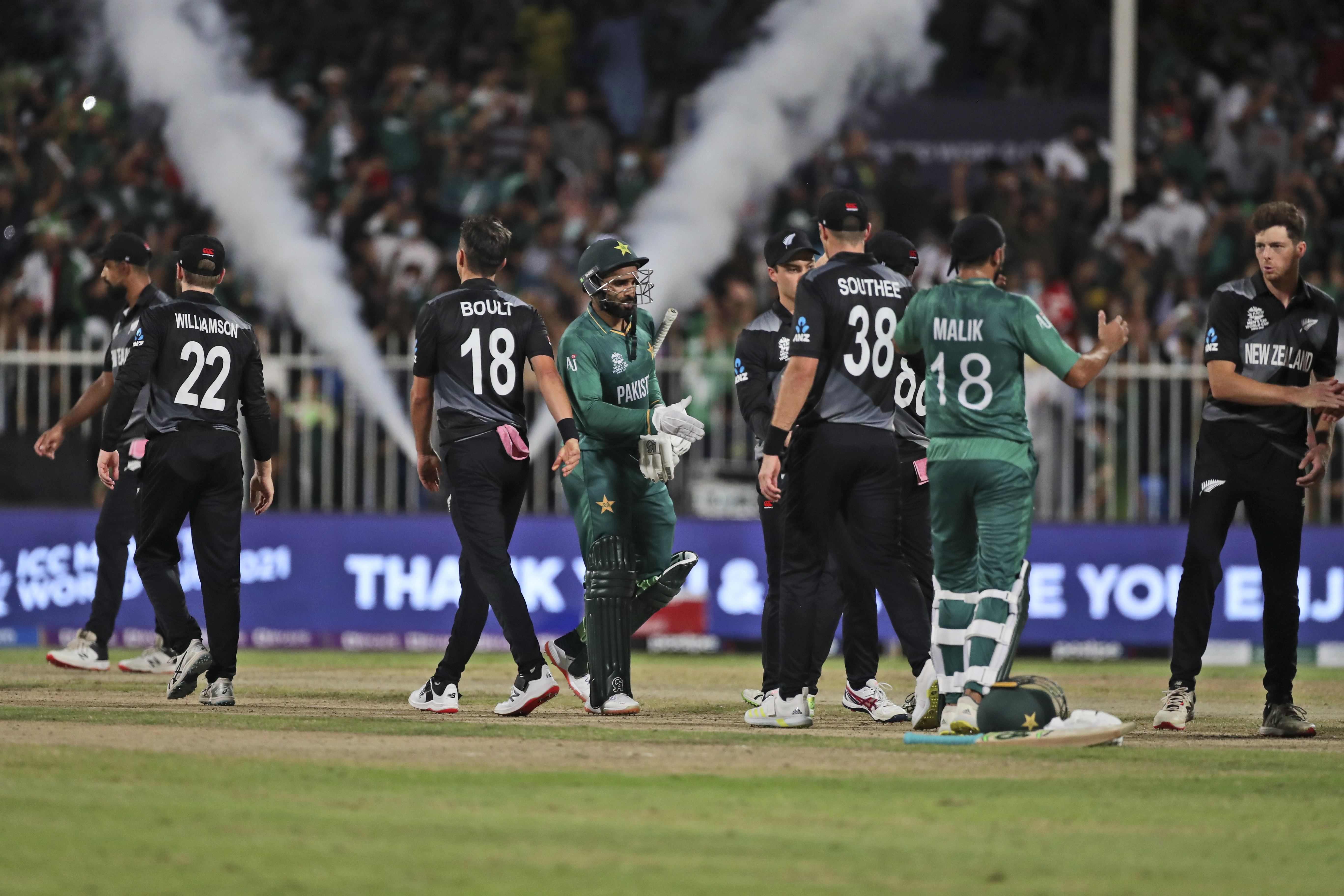 Pakistan’s Asif Ali, (centre), and Shoaib Malik greet New Zealand’s players at the end of the Cricket Twenty20 World Cup match between New Zealand and Pakistan in UAE