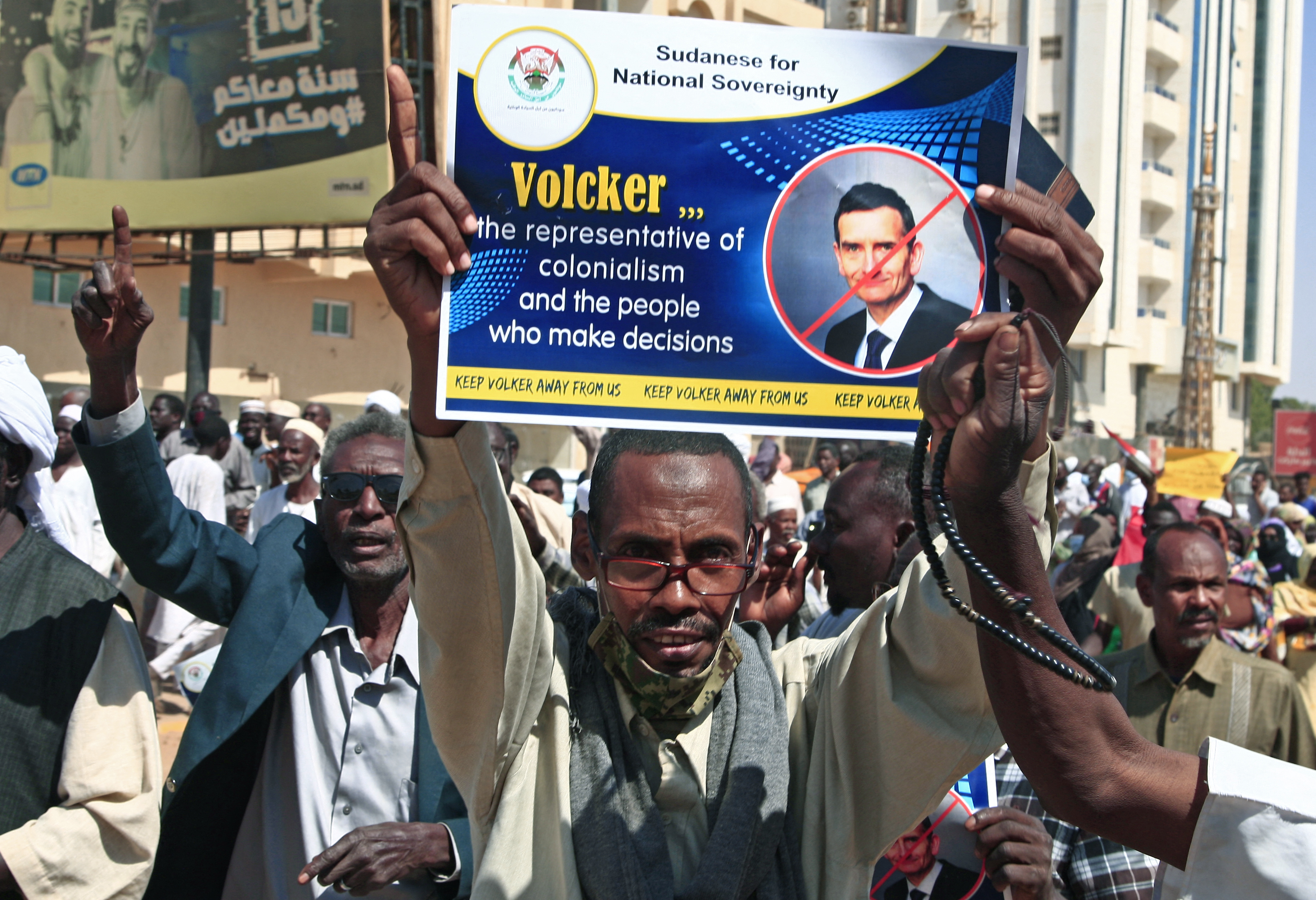 Sudanese pro-military protesters chant slogans as they demonstrate against a UN bid to resolve a political crisis outside the Khartoum office of the UN Transition Assistance Mission Sudan in the Sudanese capital on January 26, 2022. 