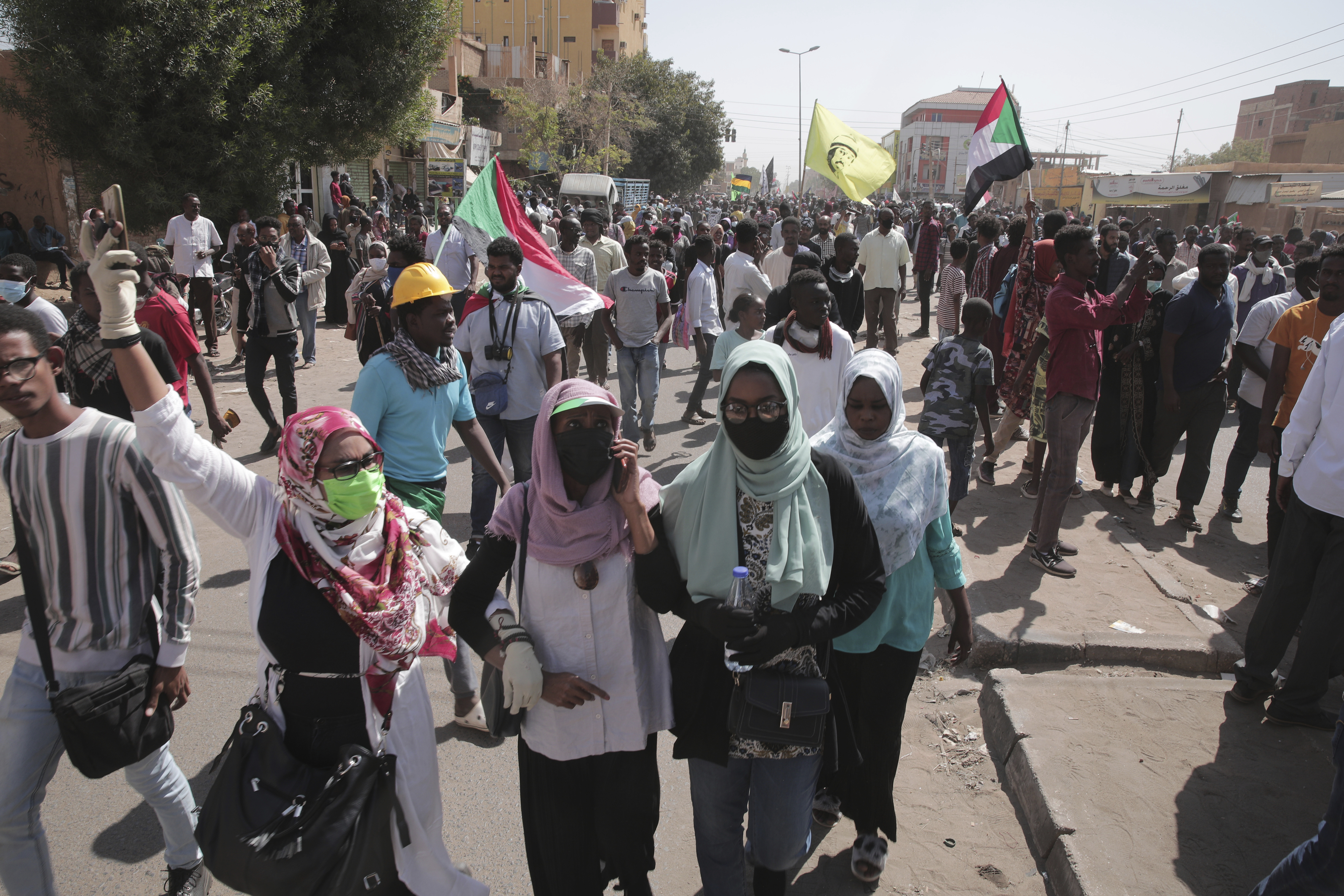 People chant slogans during a anti-coup protests that have rocked the country since a military coup three months ago.in Khartoum, Sudan, Sunday, Jan. 30, 2022.