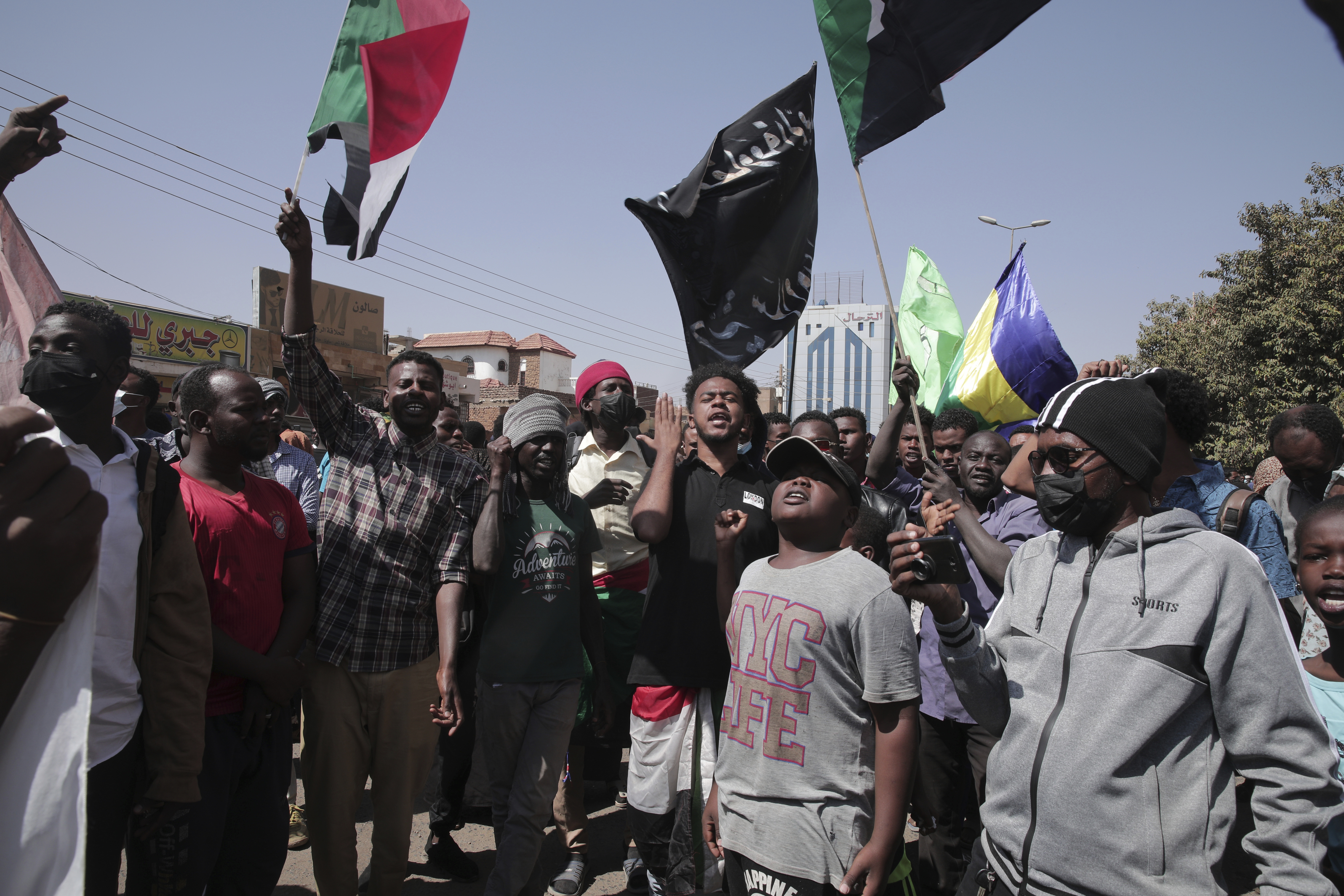 People chant slogans during anti-coup protests that have rocked the country since a military coup three months ago, in Khartoum, Sudan