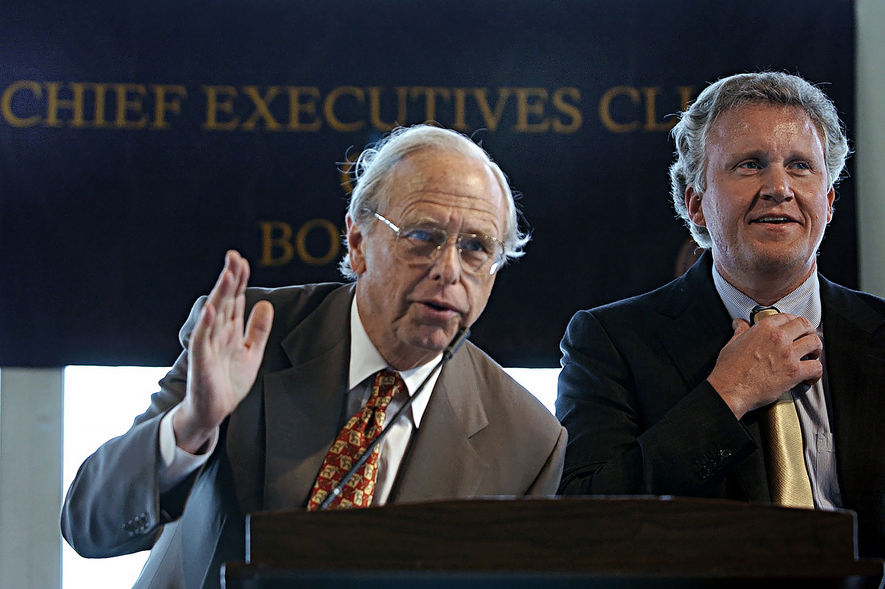 Fidelity Investments chairman & CEO Edward “Ned” Johnson III, left, addresses an audience as General Electric chairman & CEO Jeffrey R. Immelt, right, looks on