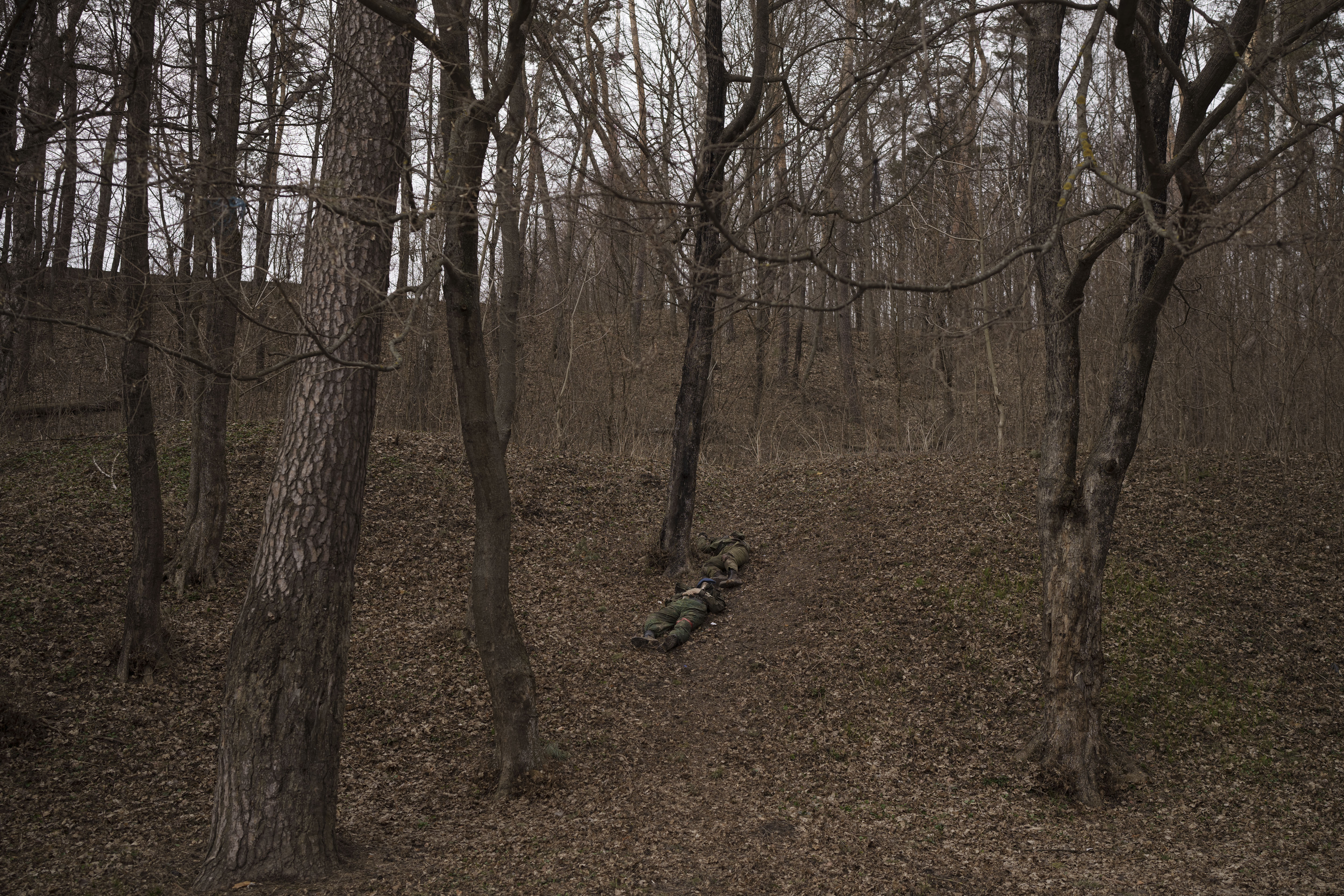 The bodies of two Russian soldiers lie in the town of Trostyanets, Ukraine
