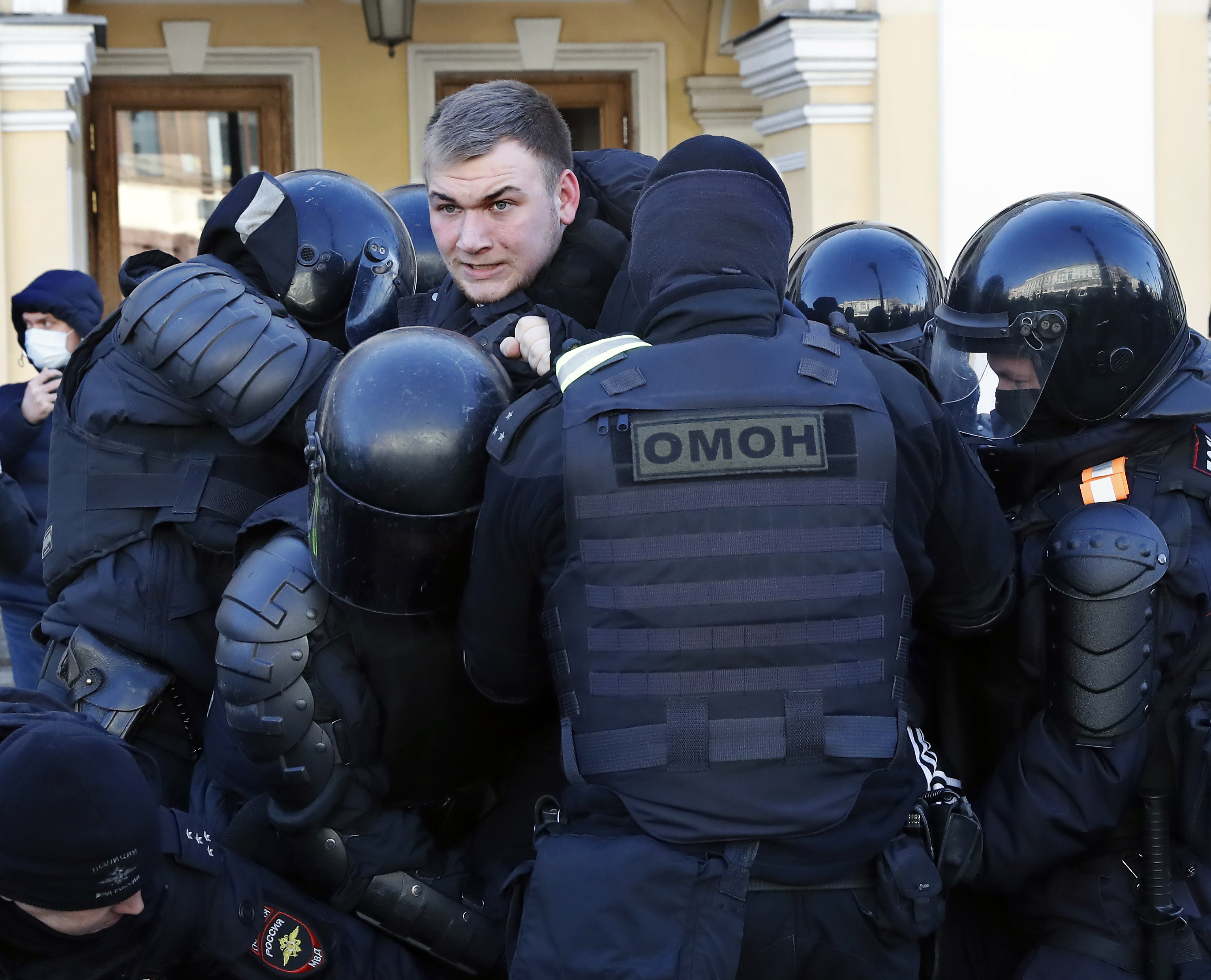Russian policemen detain a participant in an unauthorized rally against the Russian 'special military operation' in Ukraine, in Saint Petersburg