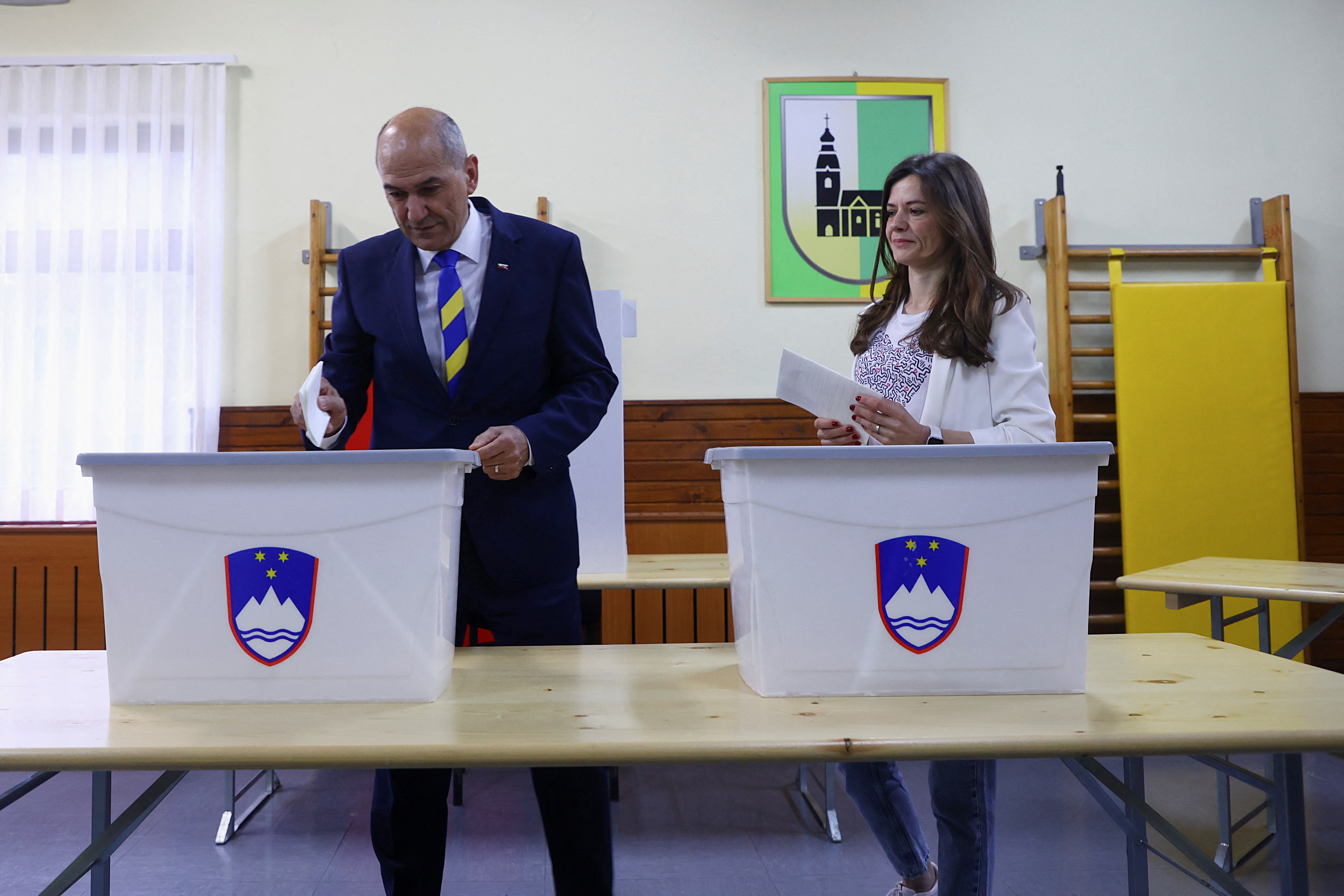 Slovenian Prime minister Janez Jansa and his wife Urska Bacovnik Jansa vote at a polling station
