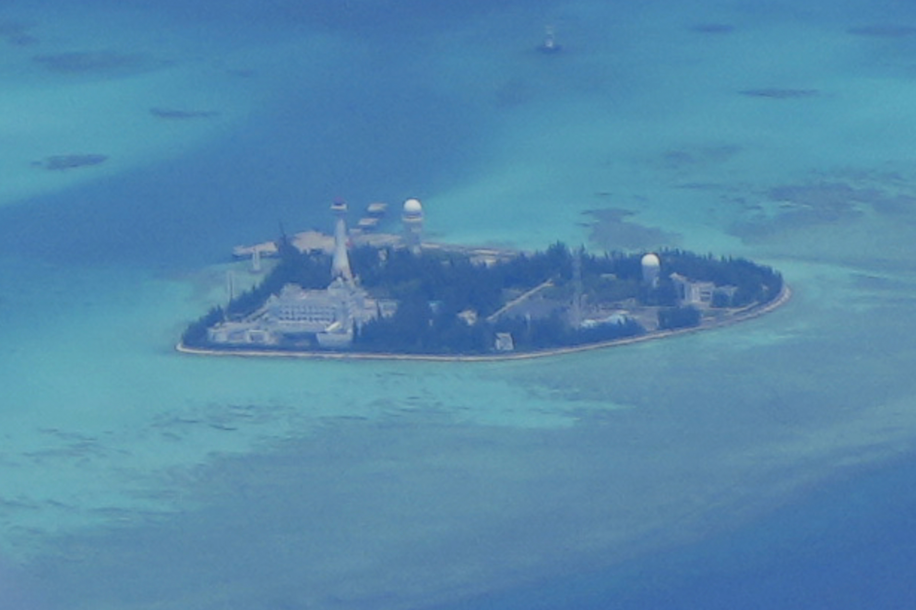 Chinese structures and buildings at the man-made island on Johnson Reef at the Spratly group of islands in the South China Sea are seen in March 2022