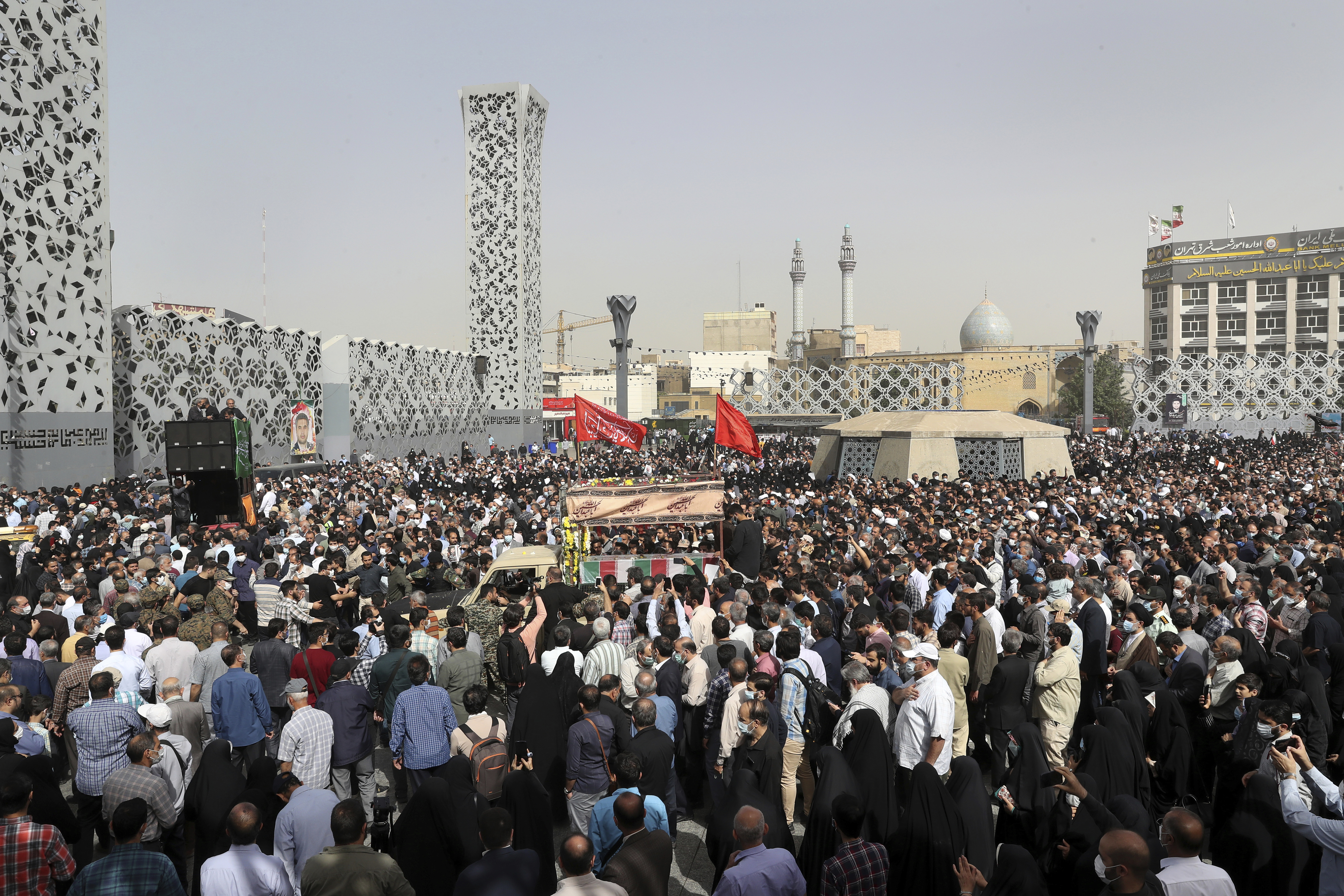 Mourners attend the funeral ceremony of Iran's Revolutionary Guard Col. Hassan Sayyad Khodaei