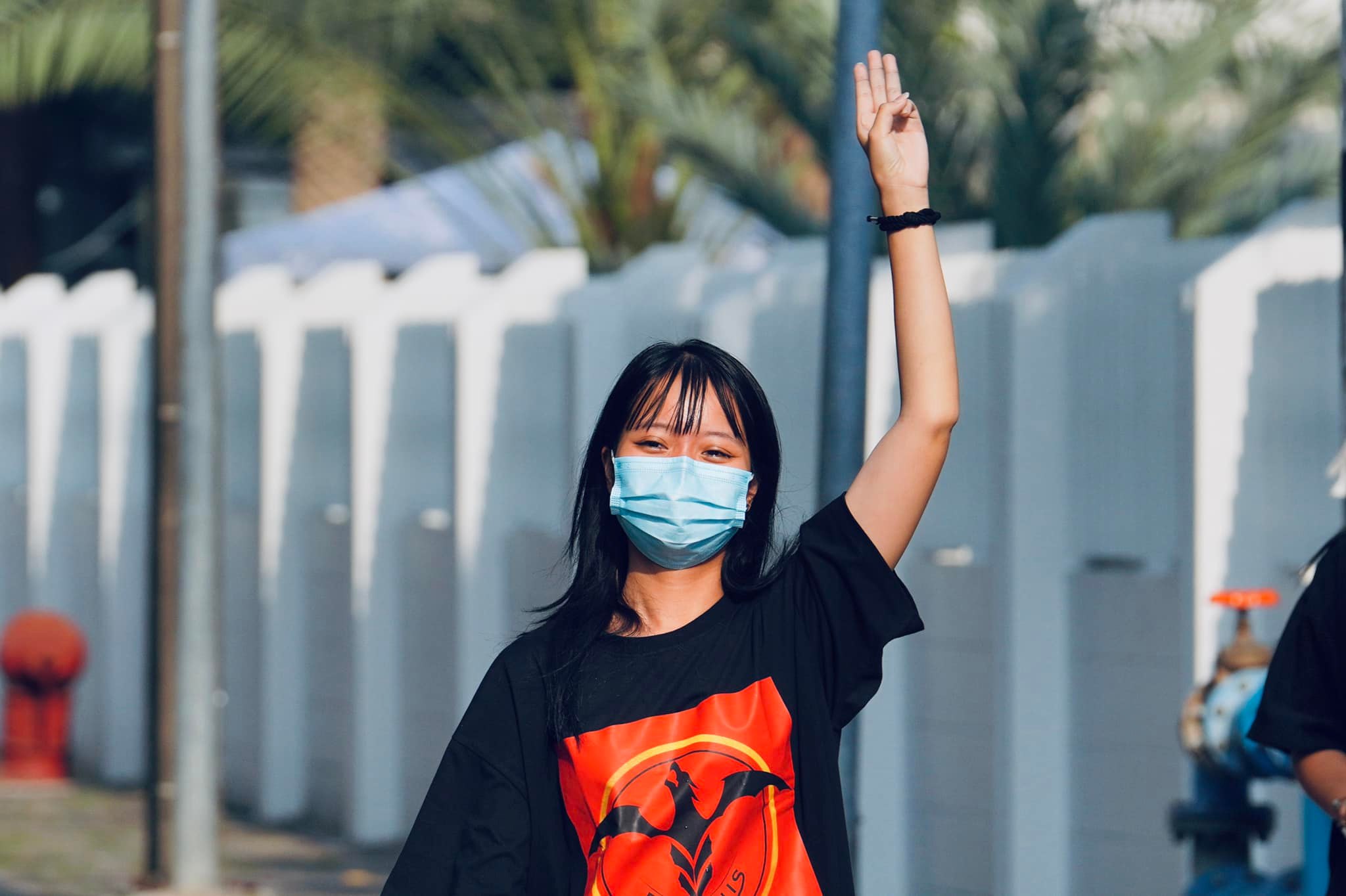 Tawan makes the three-fingered Hunger Games salute, which has become a symbol of resistance among pro-democracy groups from Myanmar to Hong Kong
