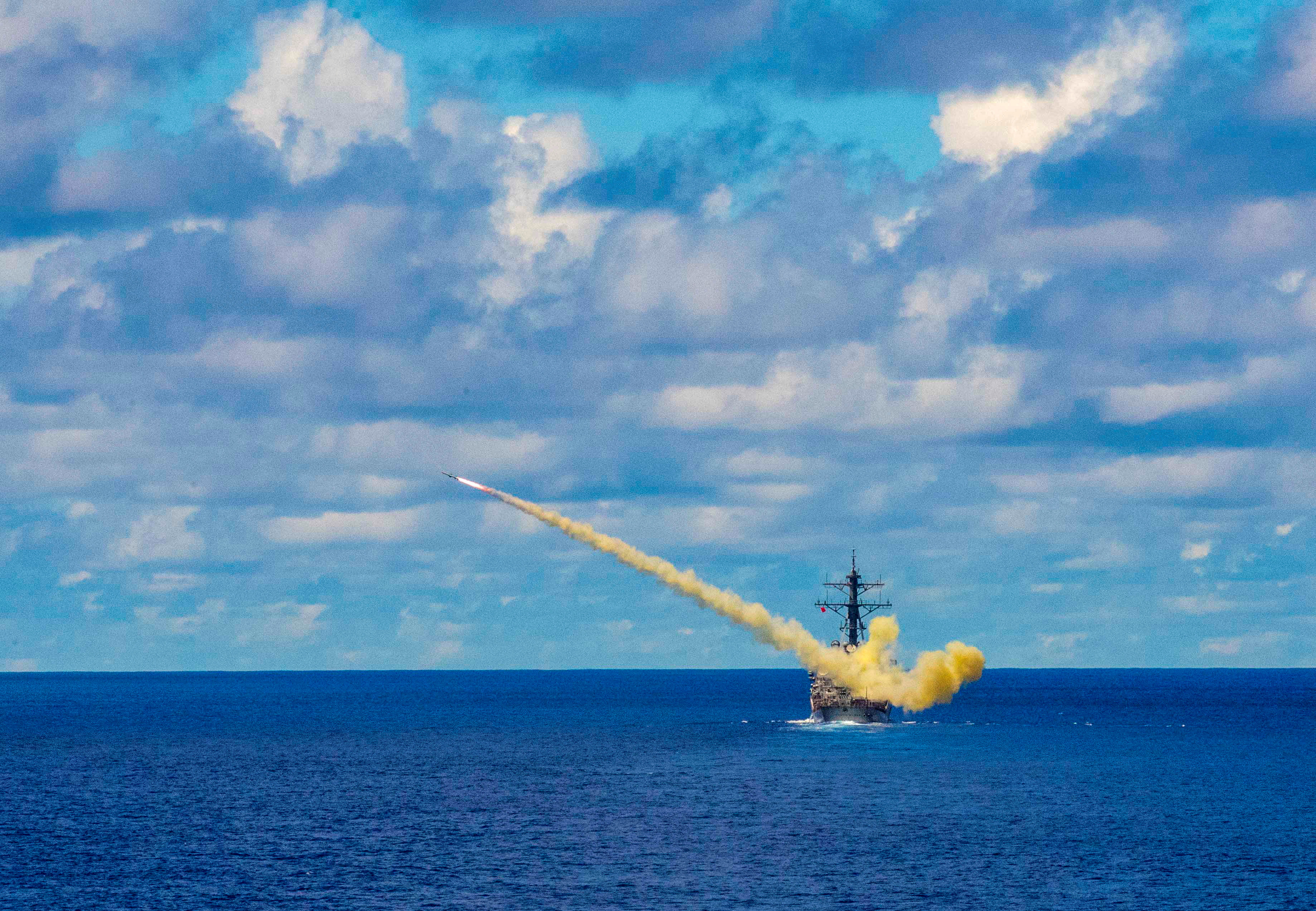 The US Navy Arleigh Burke-class guided-missile destroyer USS Curtis Wilbur launches a Harpoon surface-to-surface missile during Pacific Vanguard quadrilateral exercises between Australia, Japan, Republic of Korea, and US Naval forces in the Philippine Sea on May 26, 2019