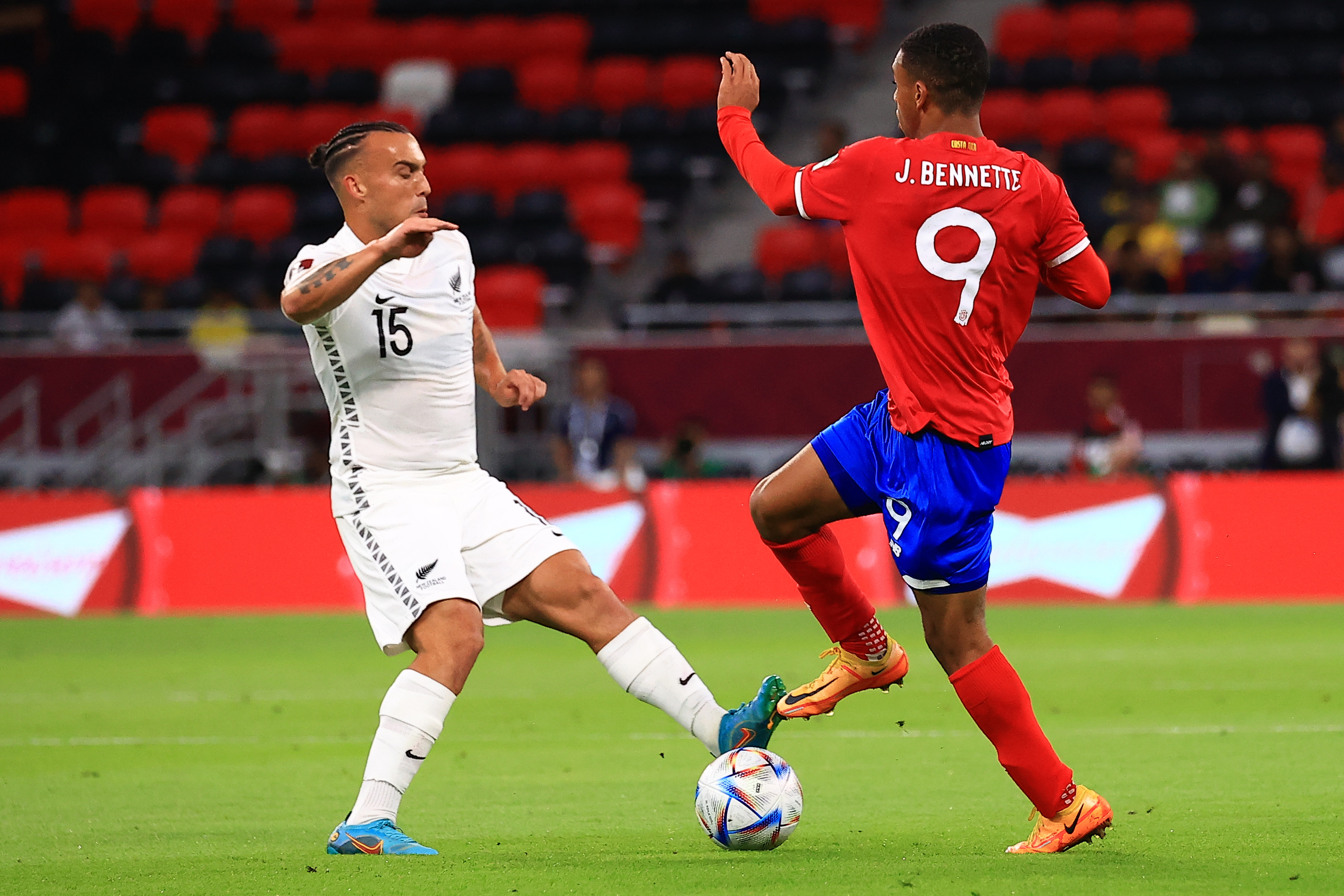 Costa Rica Jewison Bennette fights for the ball with New Zealand’s Clayton Lewis
