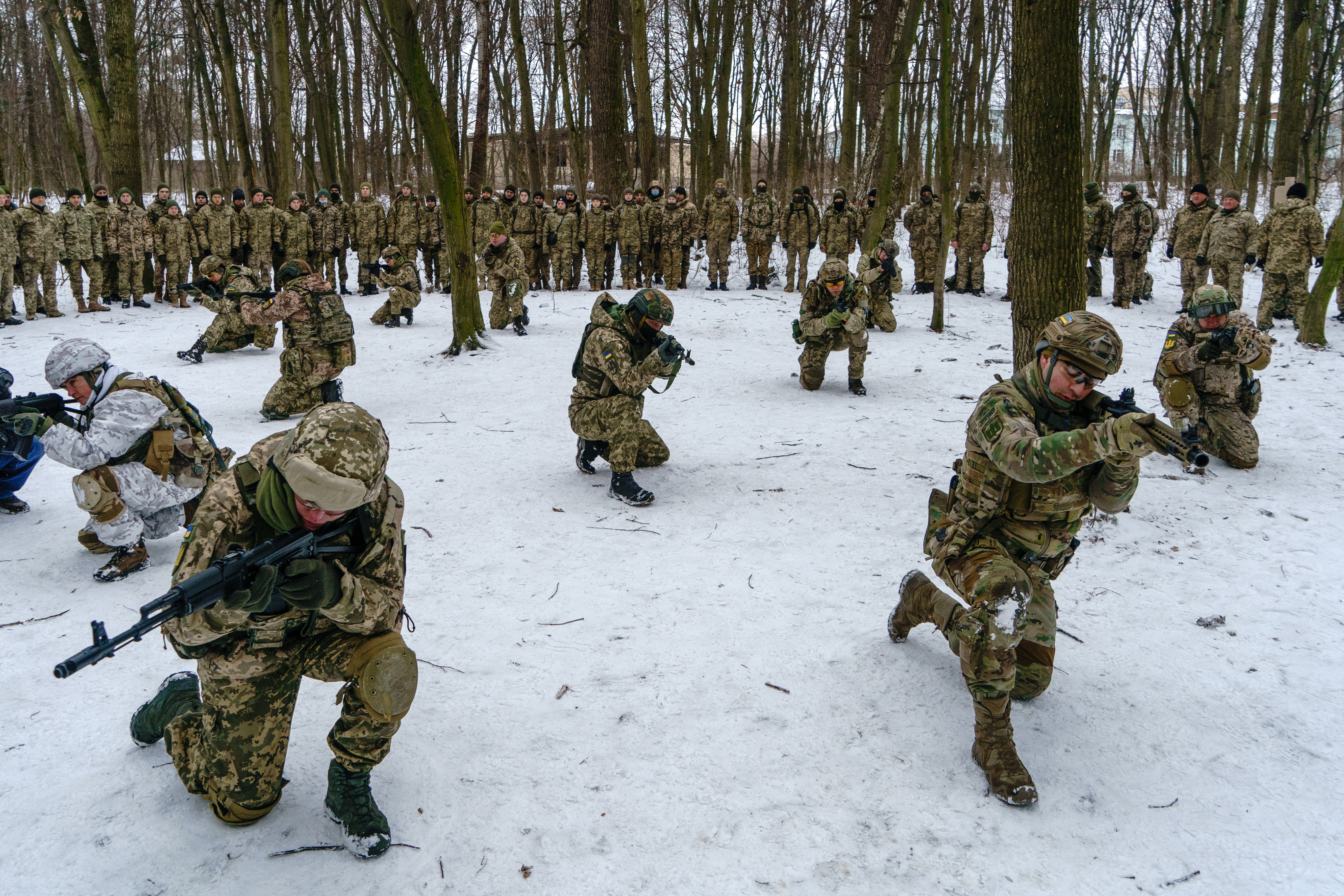 Members of Ukraine's Territorial Defence Forces, volunteer military units of the Armed Forces, train in a city park in Kyiv.