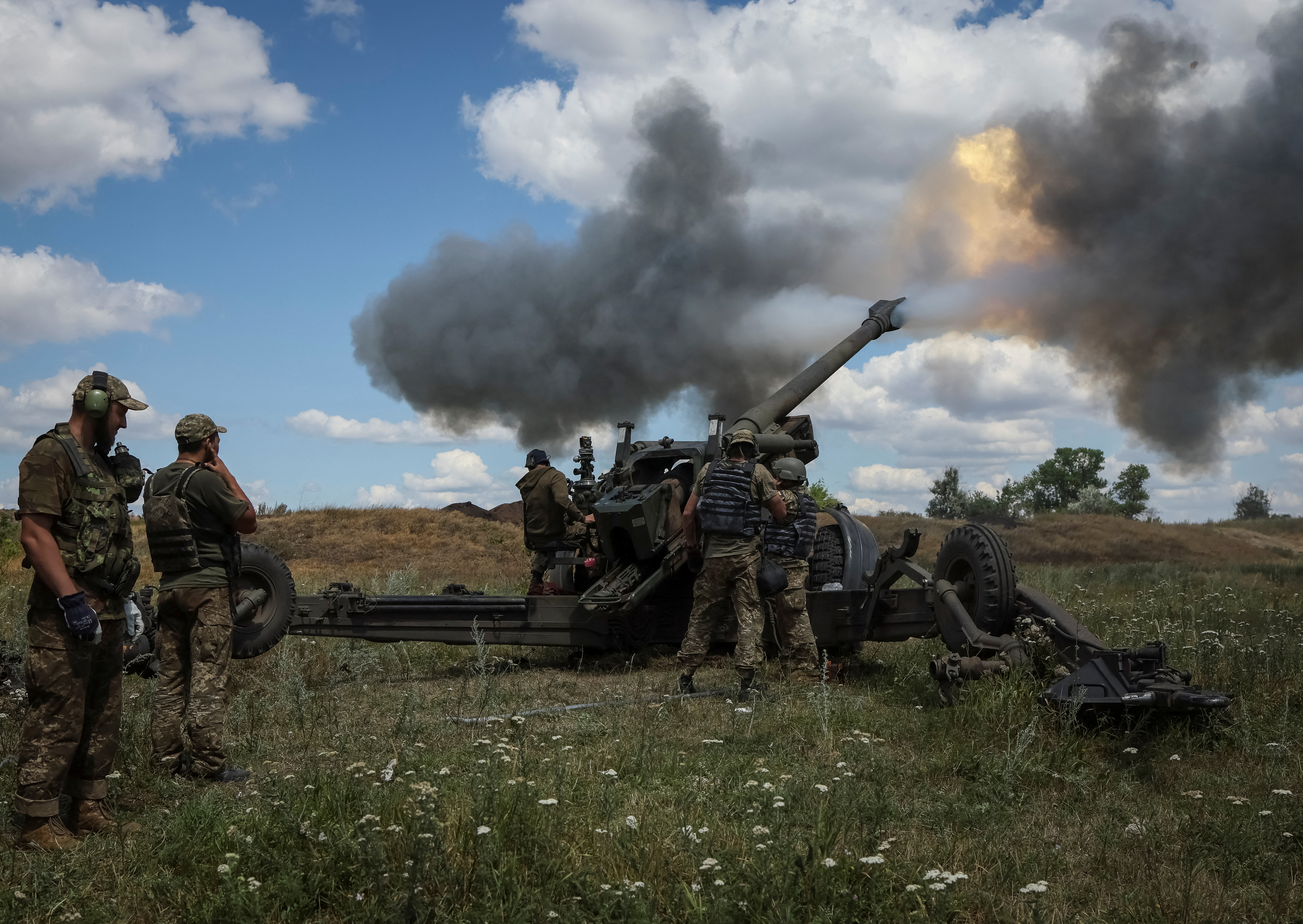 Ukrainian service members at a front line as Russia intensifies its attack on the Donbas region.