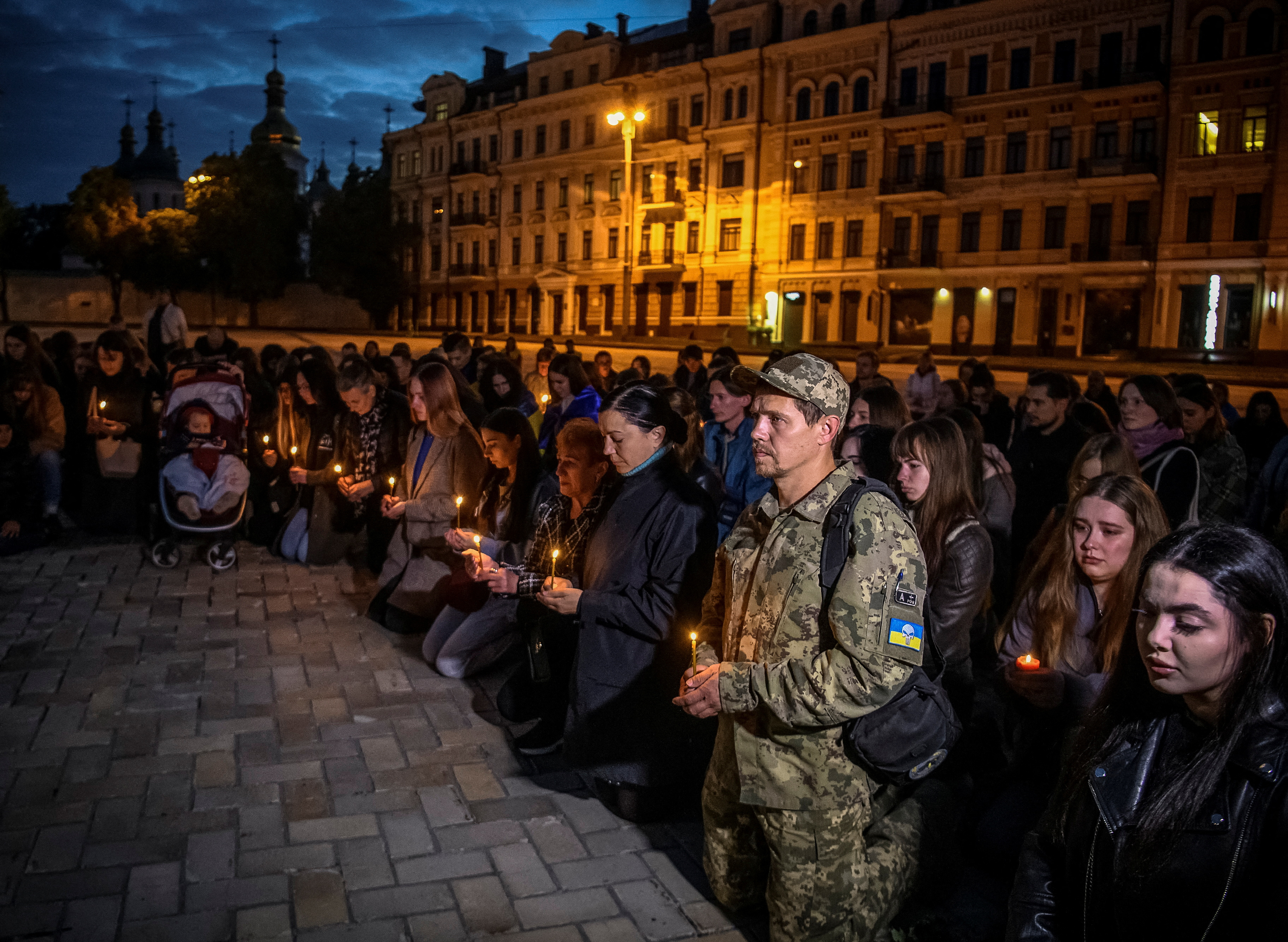 People take part in a rally demanding to recognise Russia as a state sponsor of terrorism after killing Ukrainian prisoners of war, defenders of the Azovstal Iron and Steel Works in Mariupol, in a prison in Olenivka, outside of Donetsk, as Russia's attack on Ukraine continues, in Kyiv, Ukraine September 6, 2022. REUTERS/Vladyslav Musiienko
