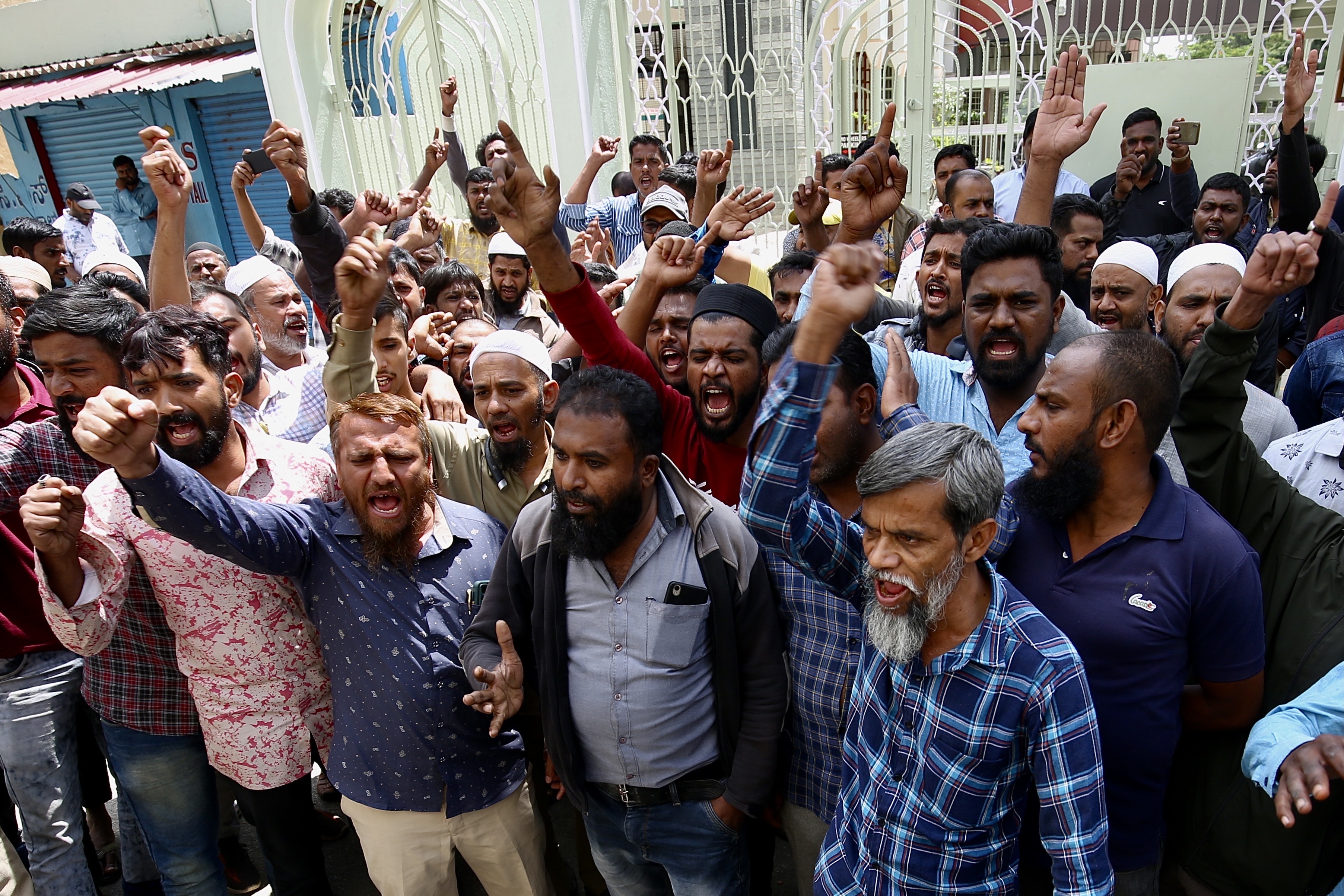 Members and supporters of PFI protest against NIA raids, in Bengaluru