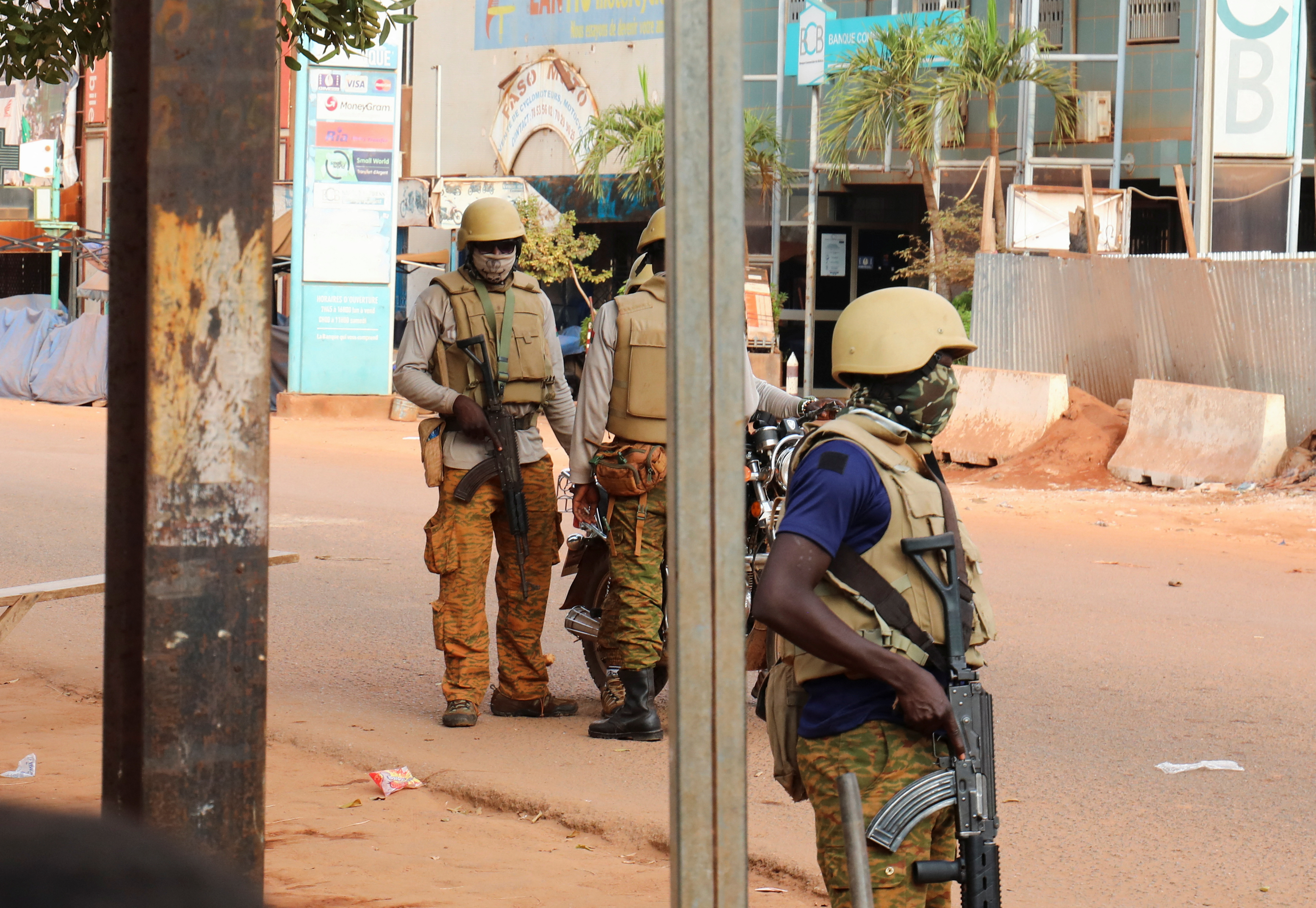 Soldiers stand guard on a street in Ouagadougou, Burkina Faso