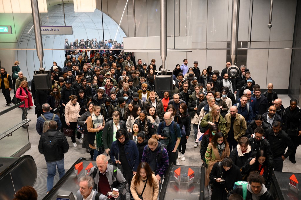 Commuters try to leave Tottenham Court Road station in London