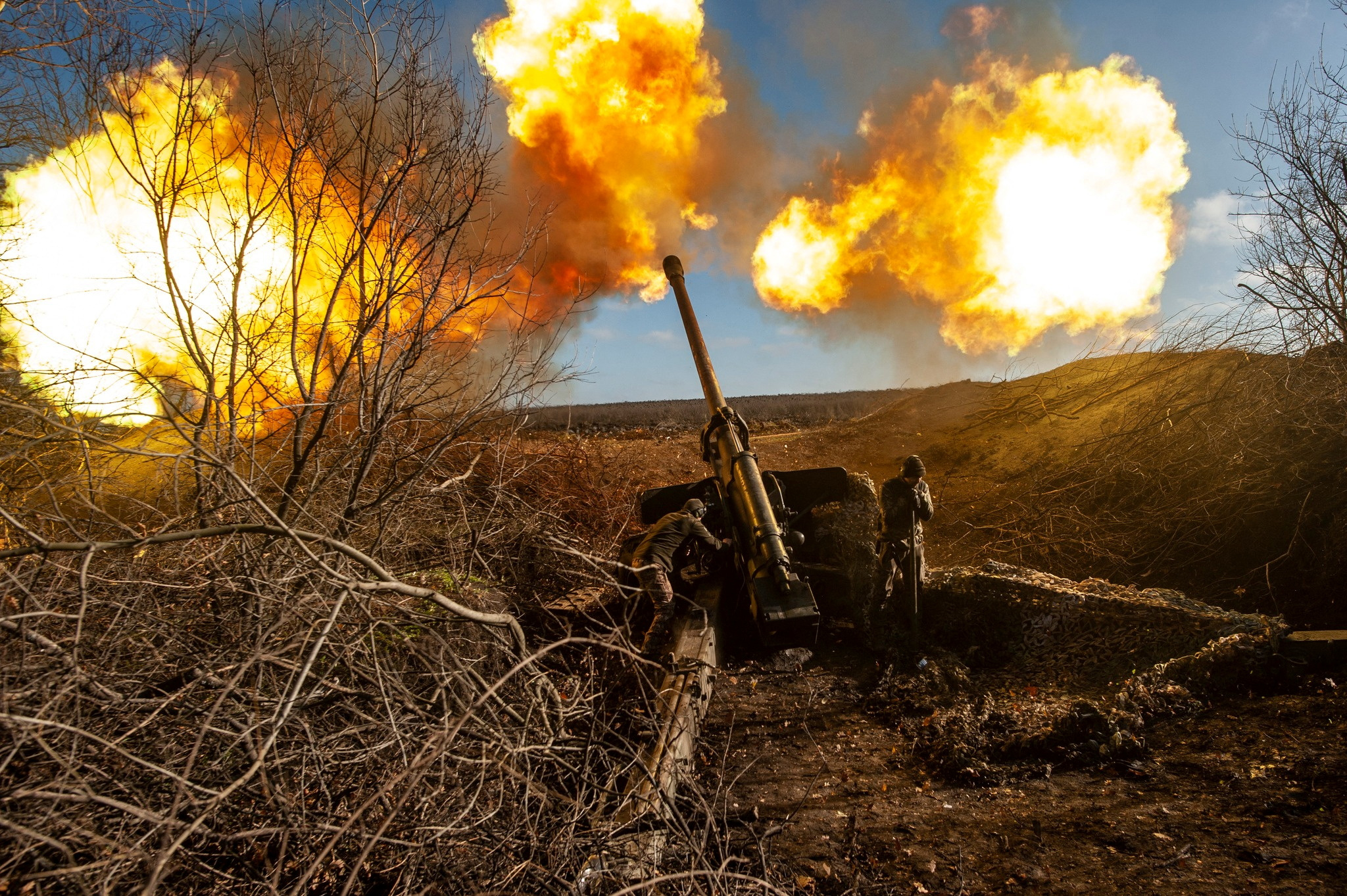 Ukrainian servicemen fire a 130 mm towed field gun M-46 on a front line, as Russia's attack on Ukraine continues, near Soledar, Donetsk region, Ukraine, in this handout image released November 10, 2022. Iryna Rybakova/Press Service of the 93rd Independent Kholodnyi Yar Mechanized Brigade of the Ukrainian Armed Forces/